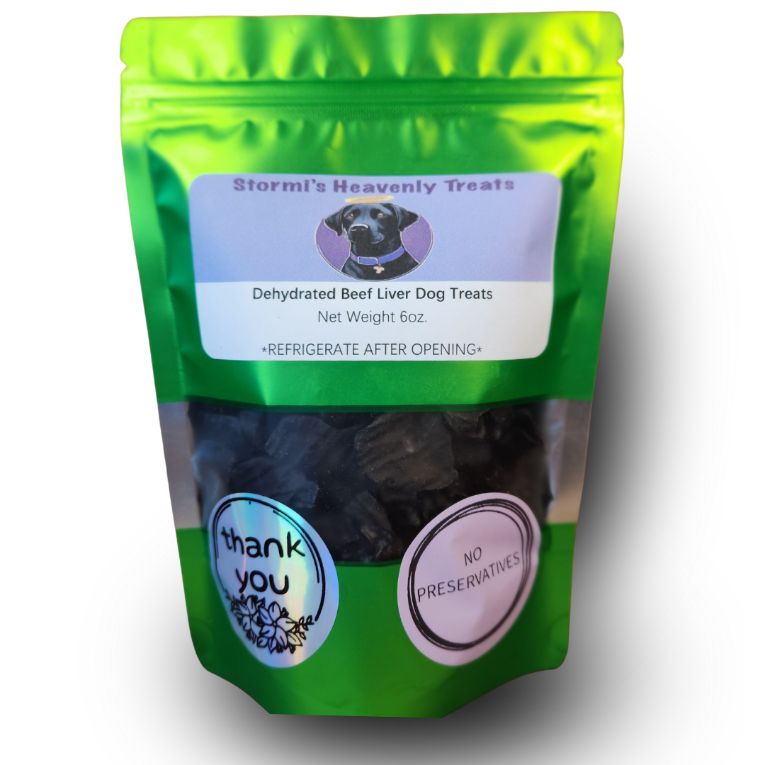 Green resealable bag of Stormi's Heavenly Treats dehydrated beef liver dog treats, net weight 6oz, with labels stating 'thank you' and 'no preservatives'.