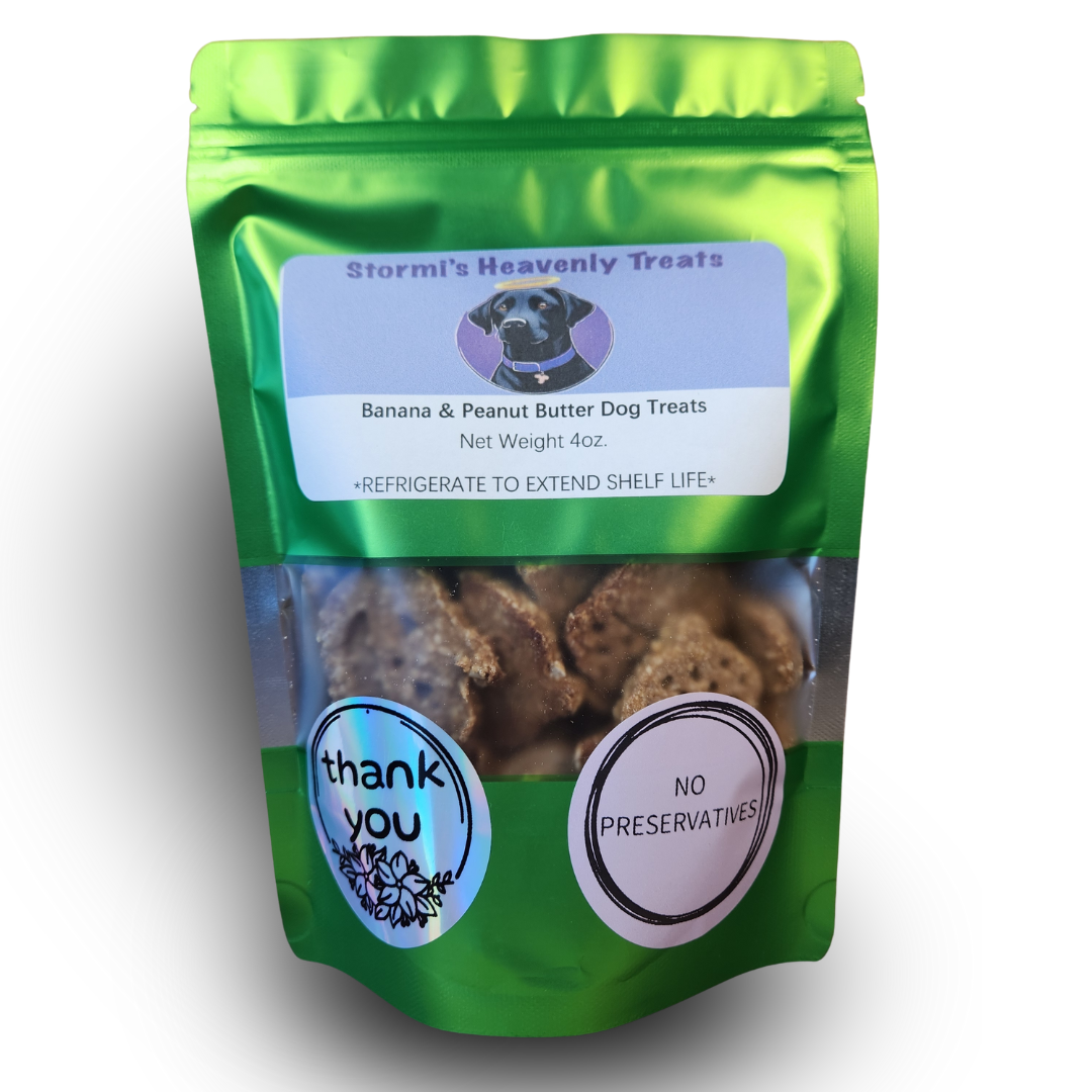 Green resealable bag of Stormi's Heavenly Treats banana and peanut butter dog treats with transparent window showing treats and stickers reading 'thank you' and 'no preservatives'.