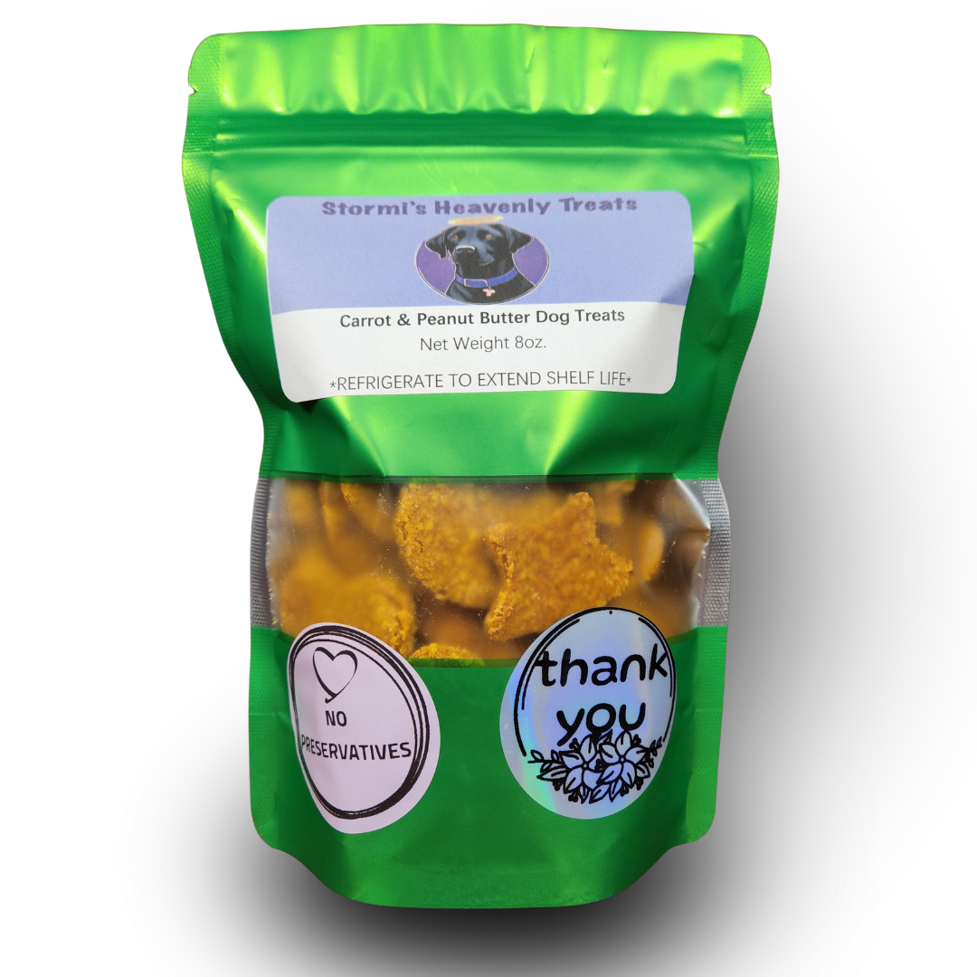 Green resealable bag of Stormi's Heavenly Treats Carrot & Peanut Butter Dog Treats, weighing 8 oz, with no preservatives and a thank you sticker.