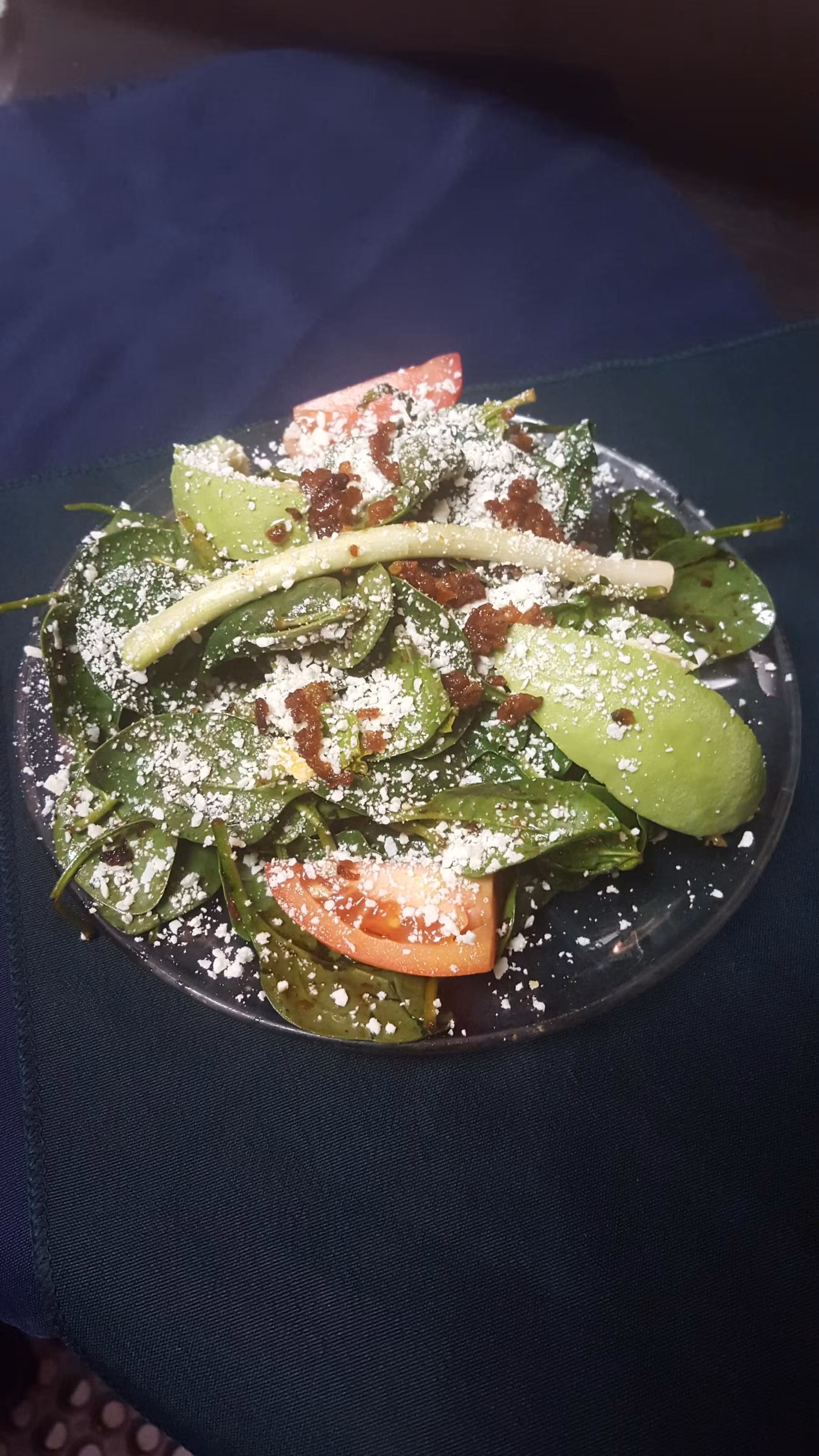 Salad plate garnished with grated cheese.