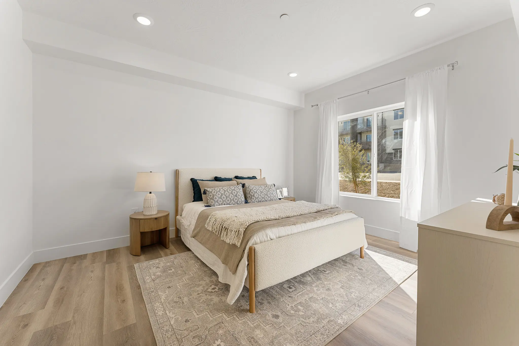 Spacious and modern apartment bedroom at Ascesa Court in St. George, UT.