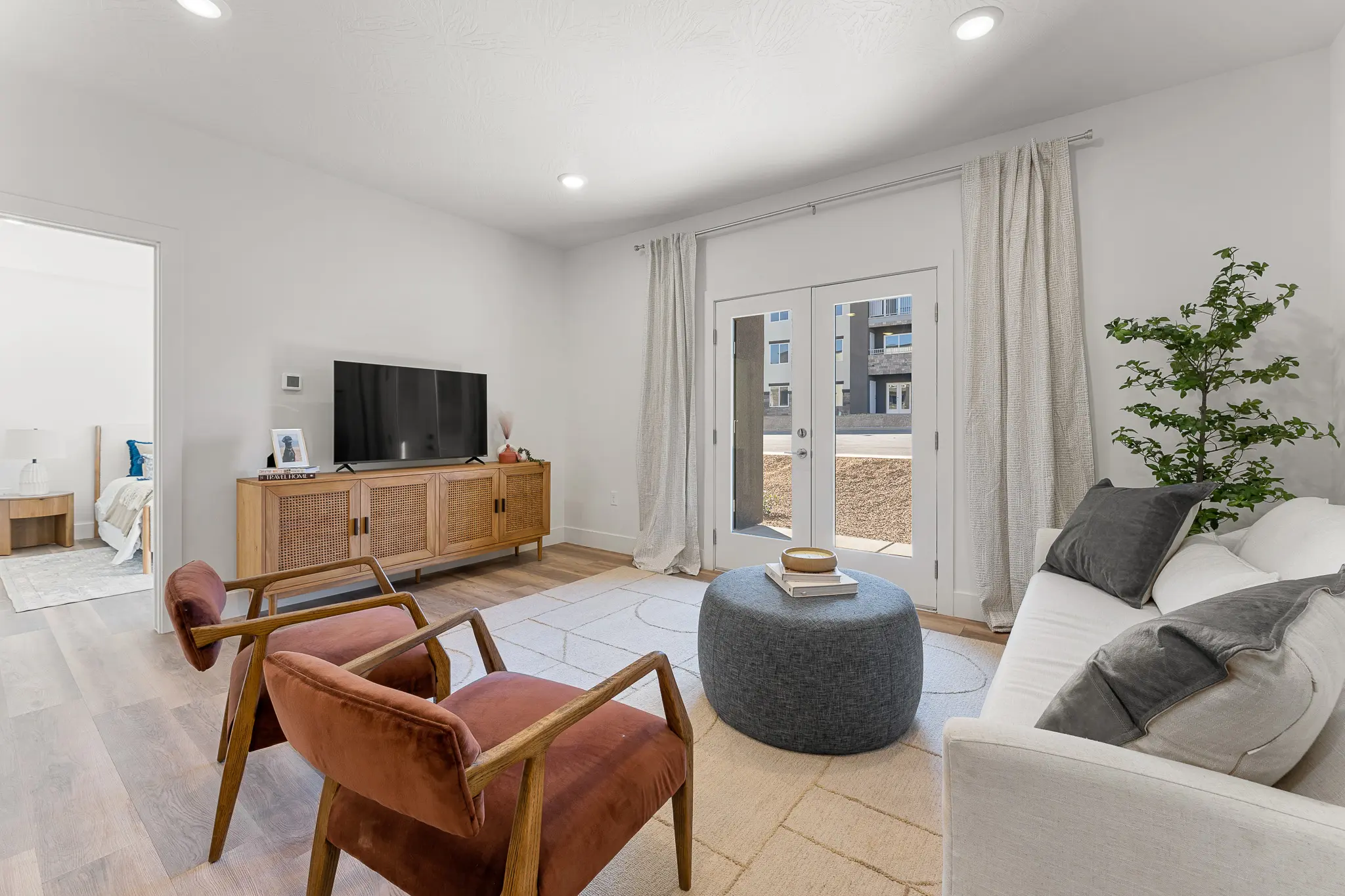 Spacious and modern apartment living area at Ascesa Court in St. George, UT.