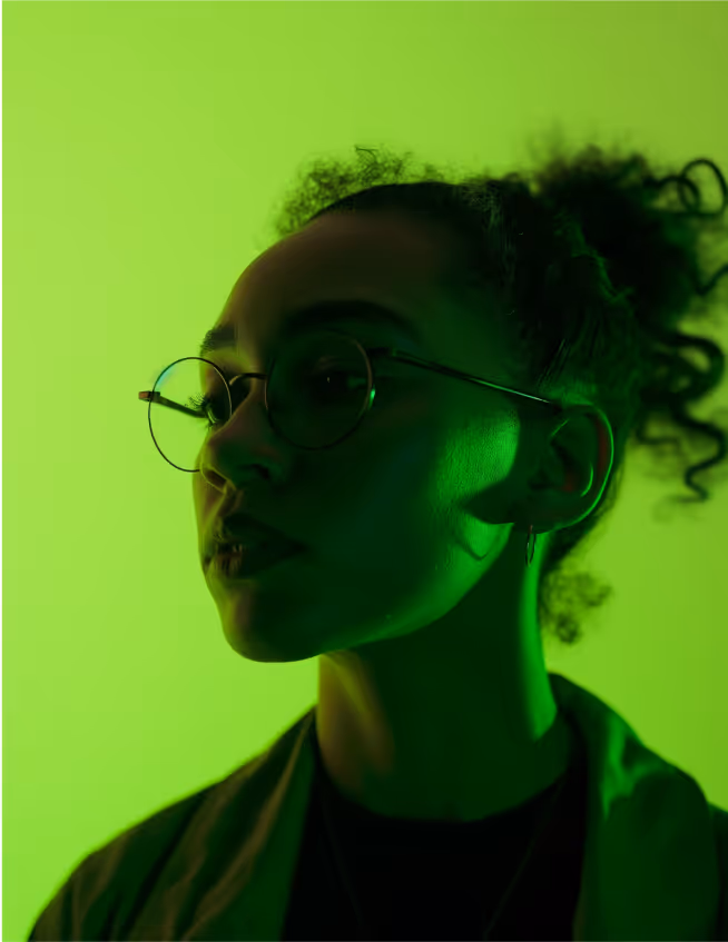 a woman with glasses and curly hair