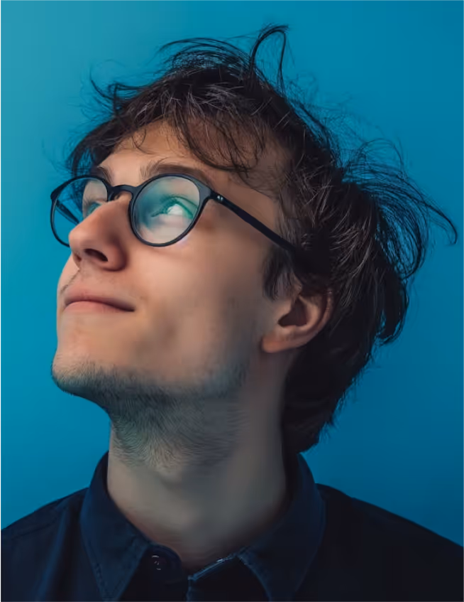 a man looking up with his eyes closed