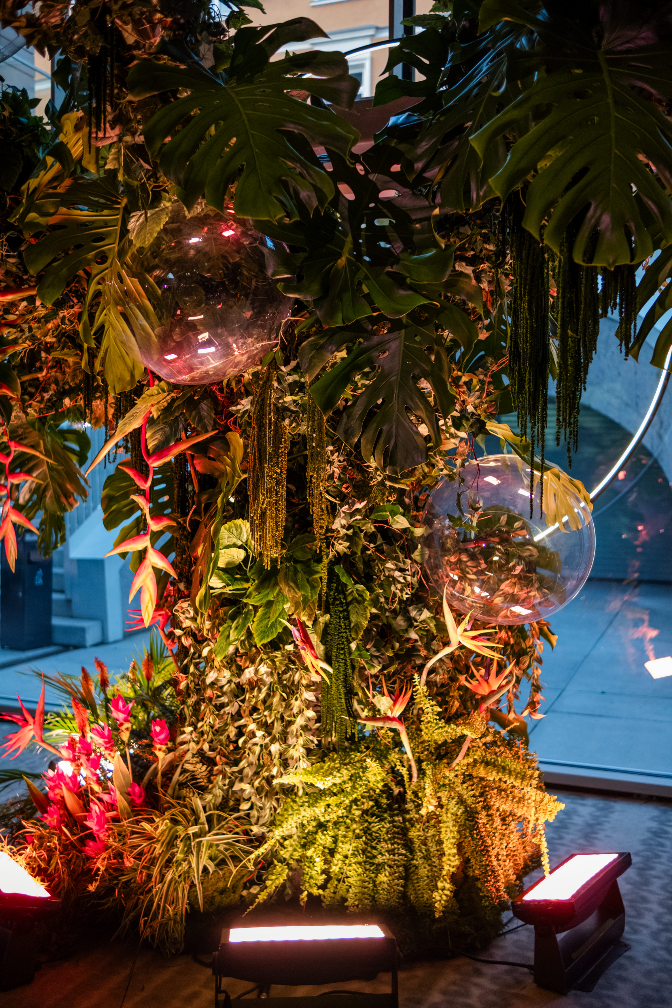 Bride and groom standing at the altar in a church with uniformed guards holding swords forming an arch along the aisle.