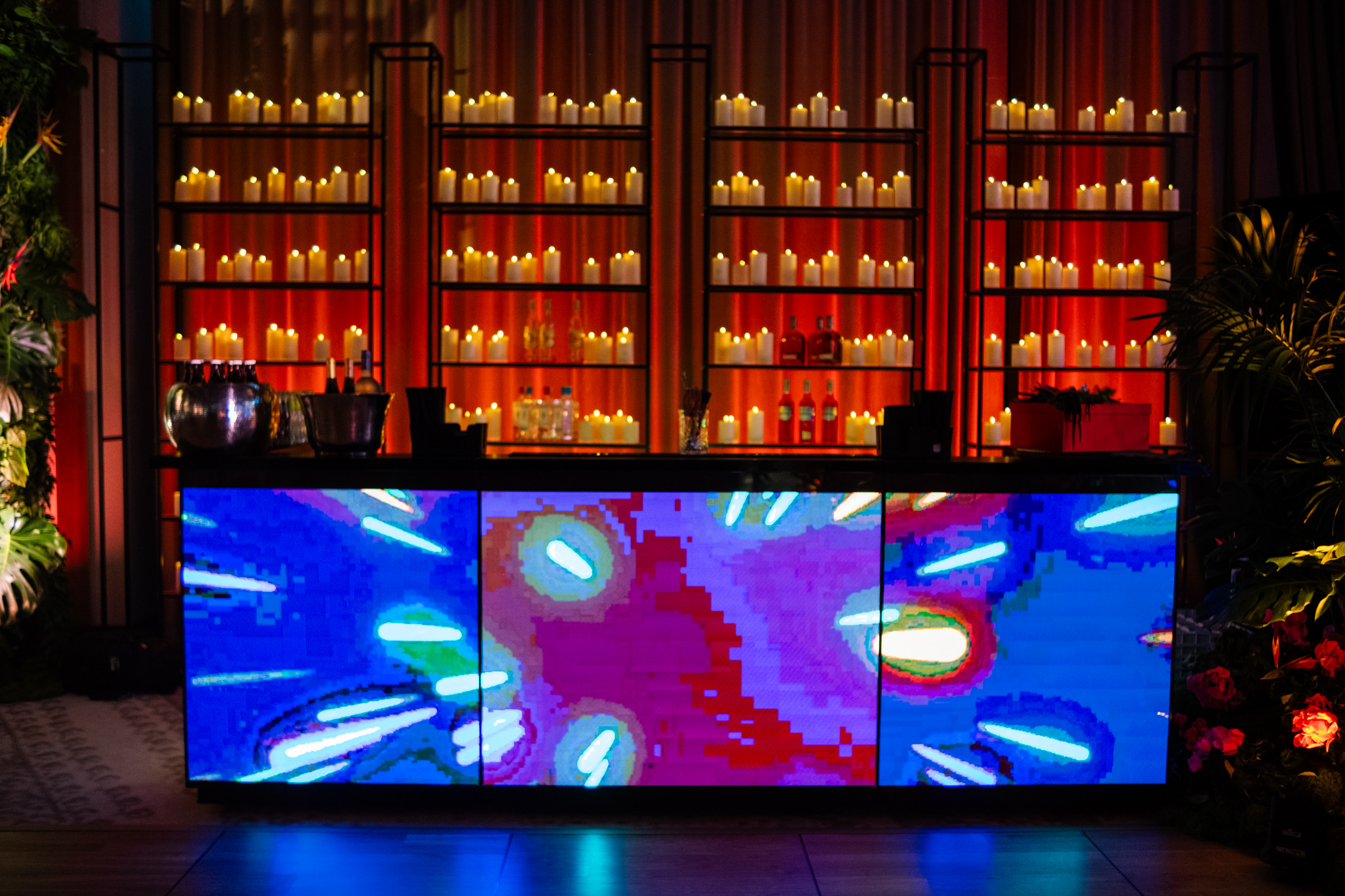 Uniformed men holding swords forming an archway in a decorated church with guests seated on either side.