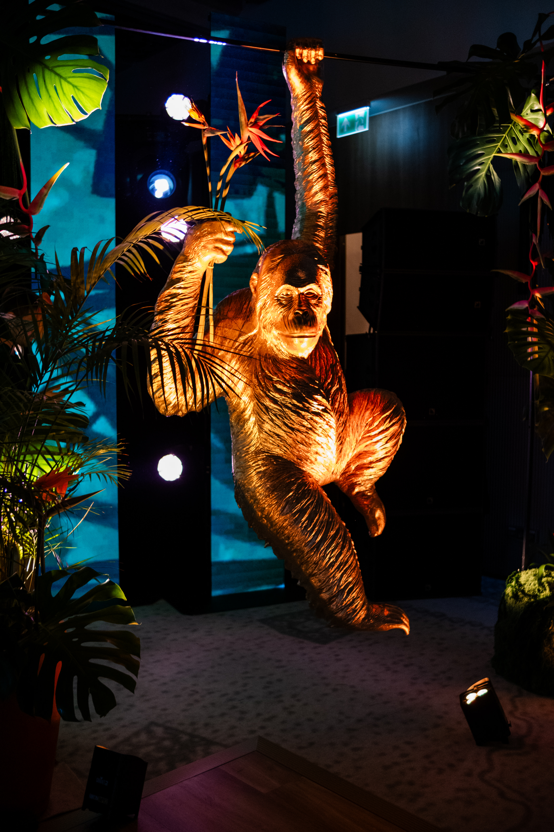 Bride and groom standing at the altar in a church with uniformed guards holding swords forming an arch along the aisle.