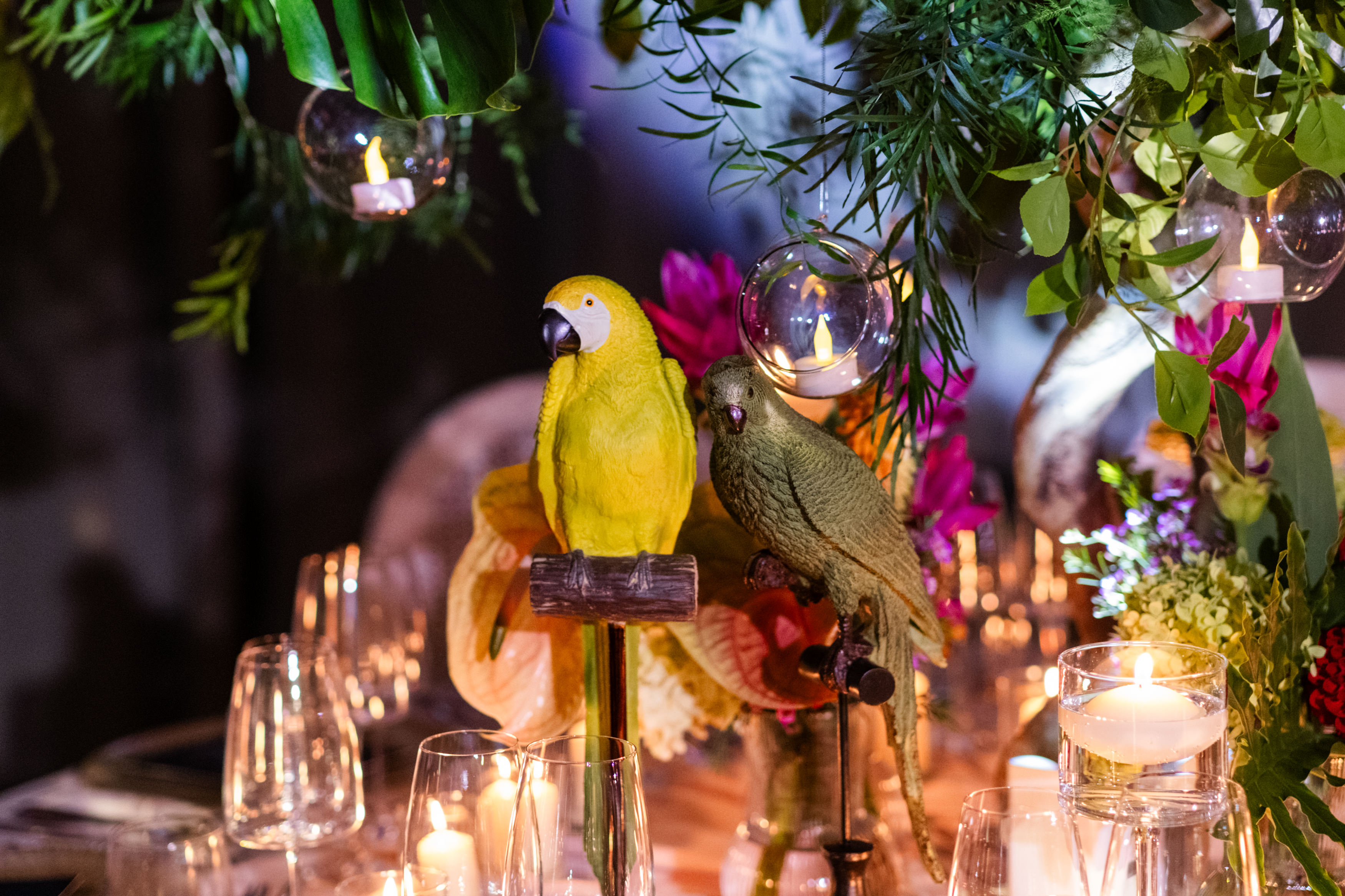 Uniformed men holding swords forming an archway in a decorated church with guests seated on either side.