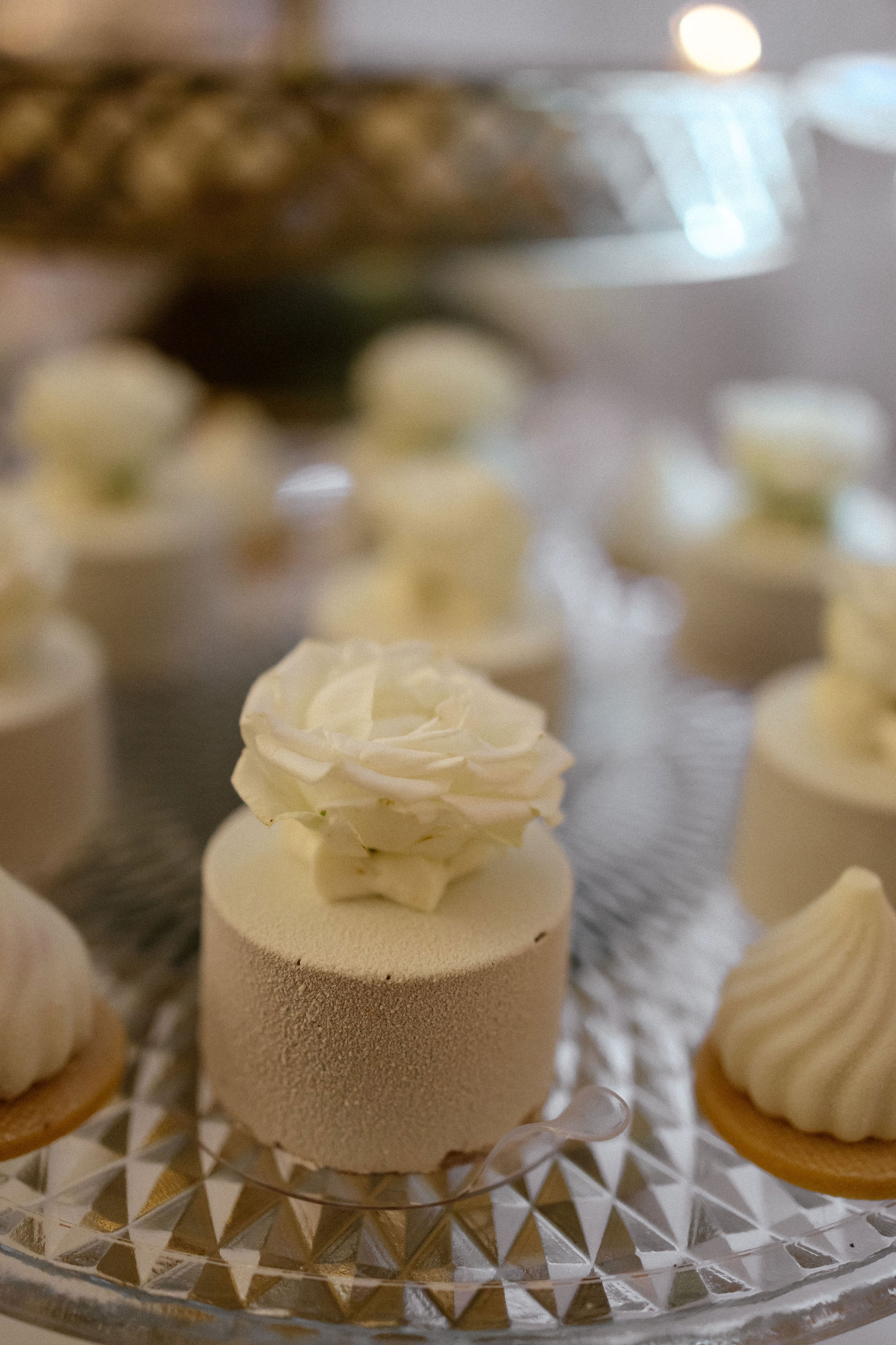 Bride and groom standing at the altar in a church with uniformed guards holding swords forming an arch along the aisle.