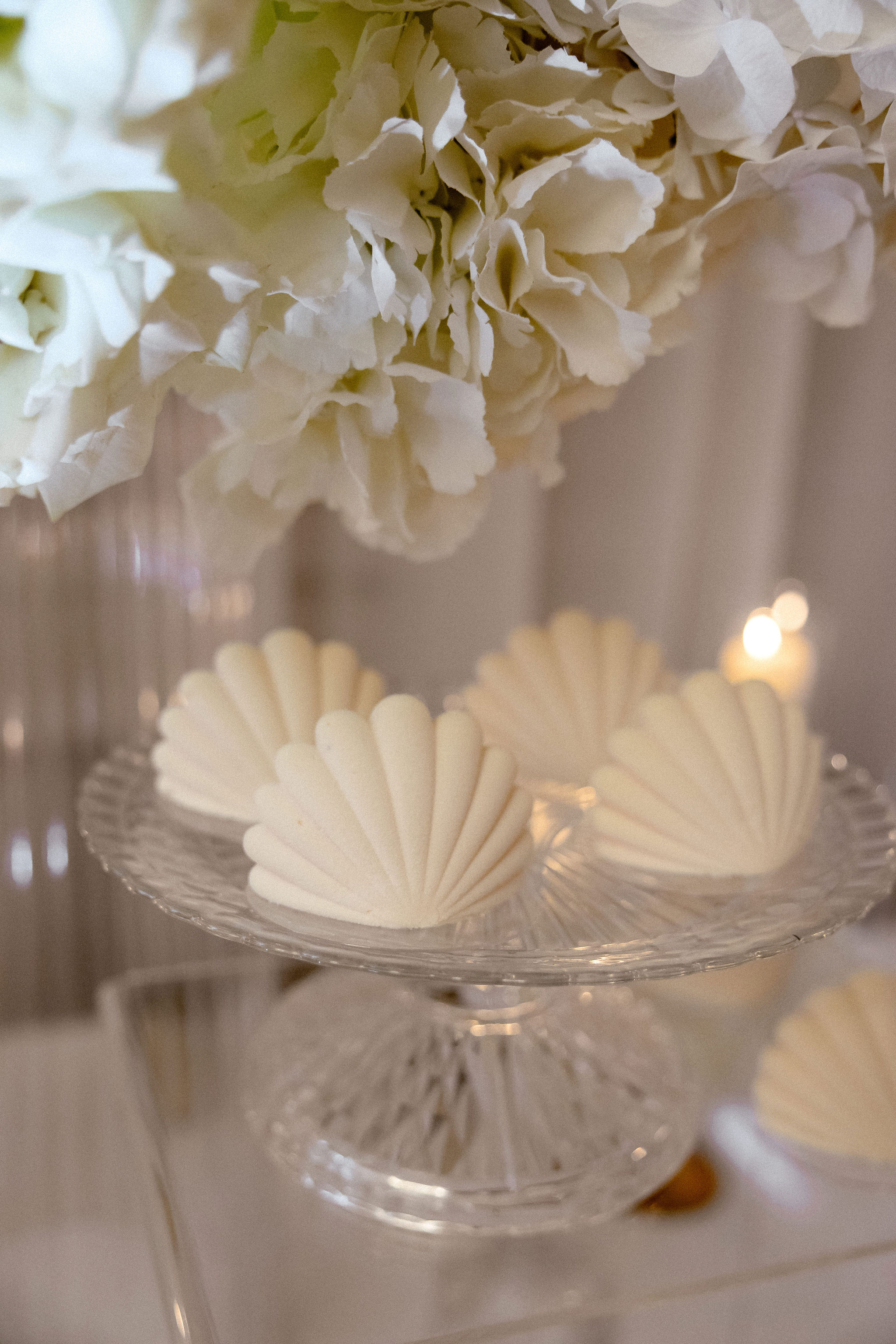 Bride and groom standing at the altar in a church with uniformed guards holding swords forming an arch along the aisle.
