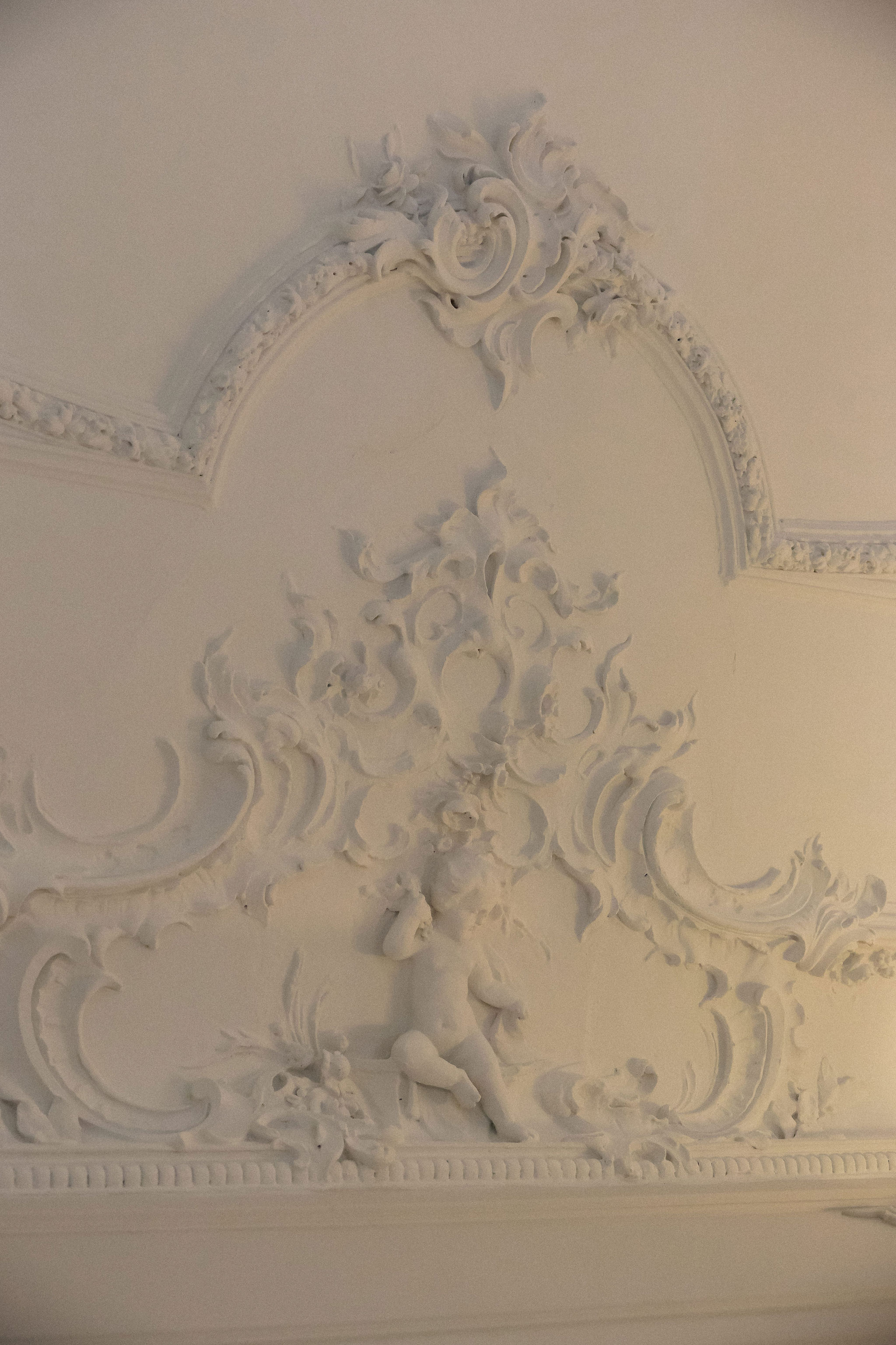 Bride and groom standing at the altar in a church with uniformed guards holding swords forming an arch along the aisle.
