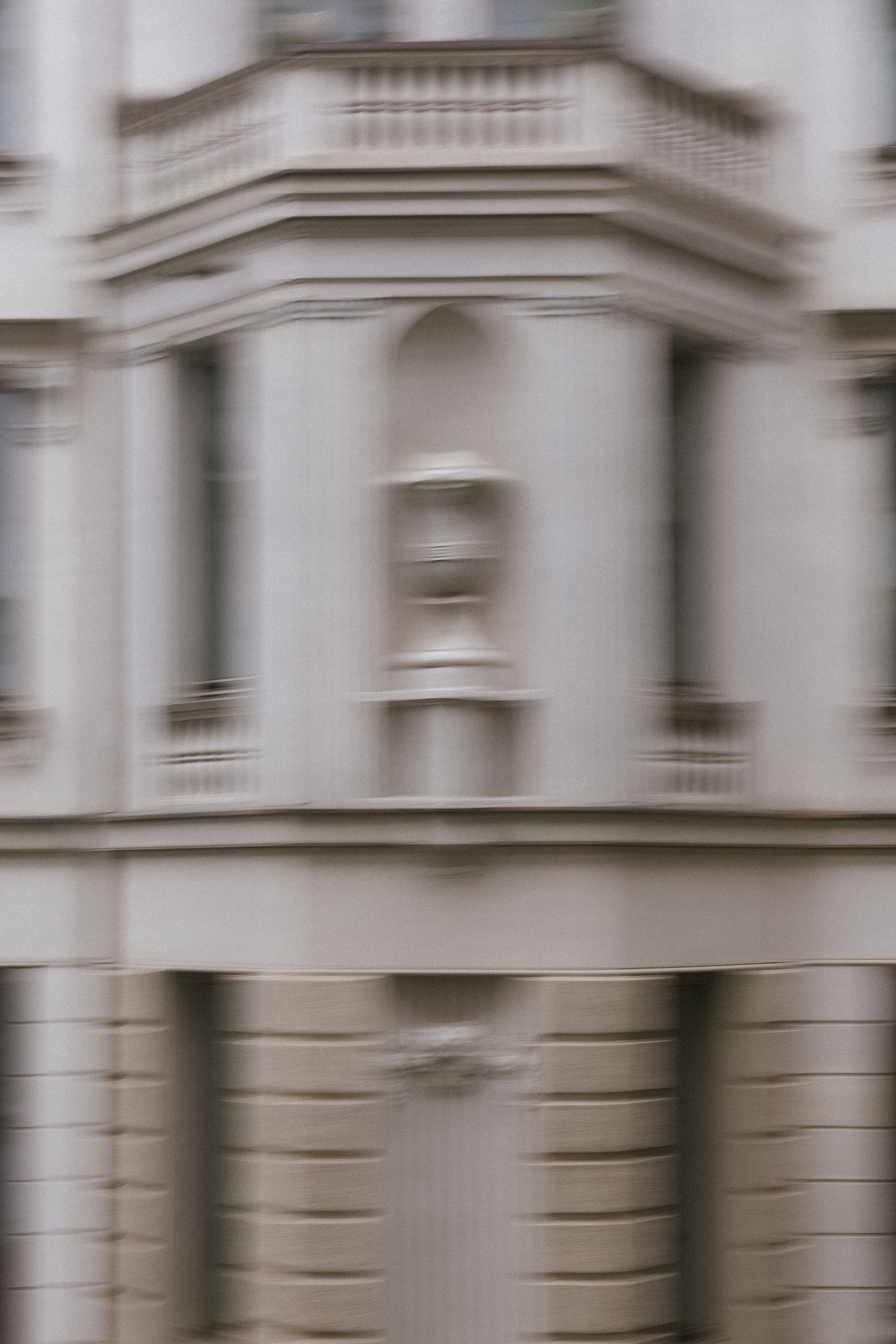 Bride and groom standing at the altar in a church with uniformed guards holding swords forming an arch along the aisle.