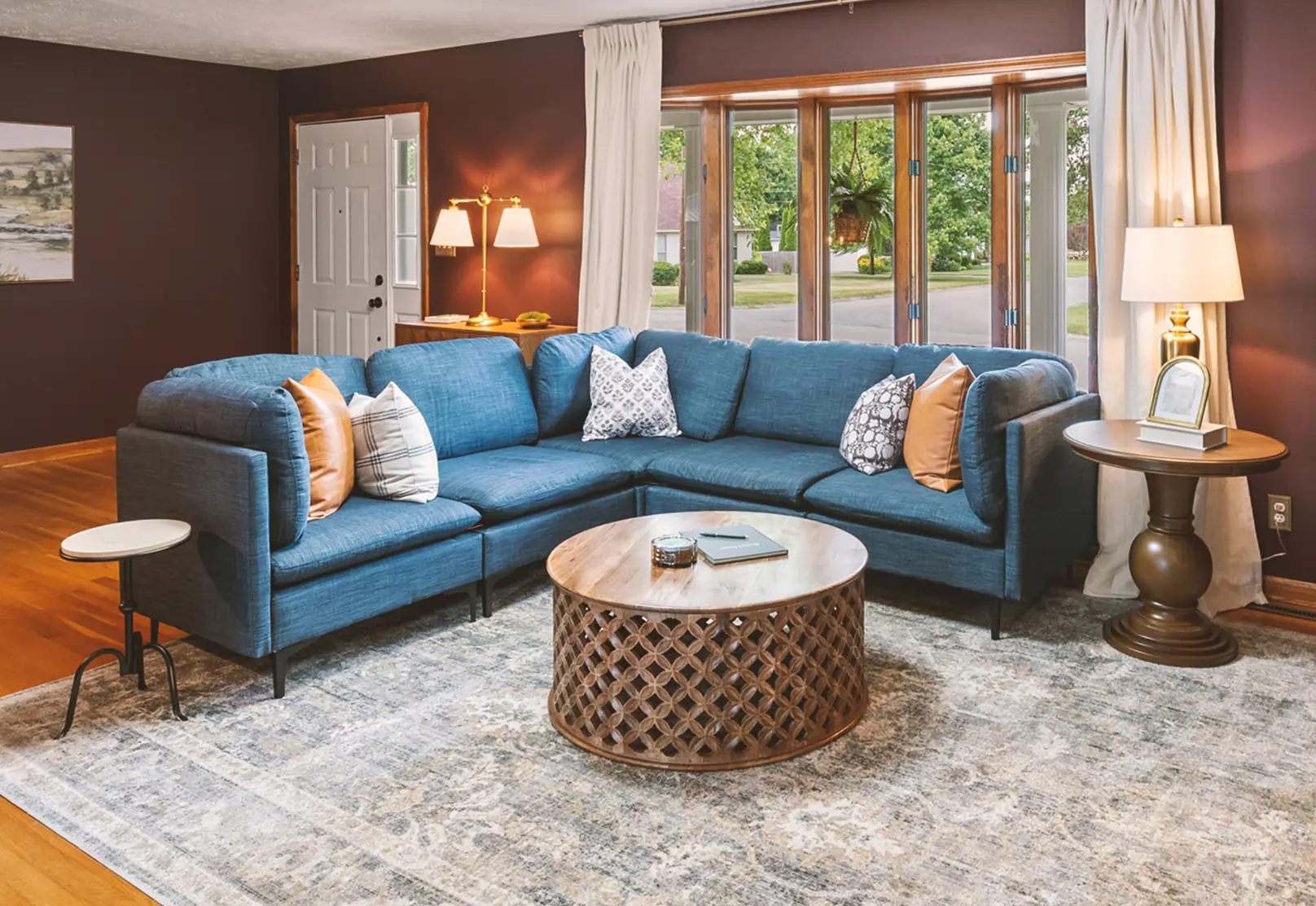 Living Room in rental property, Roxie House. Clean, luxurious farmhouse modern displaying the large navy couch.