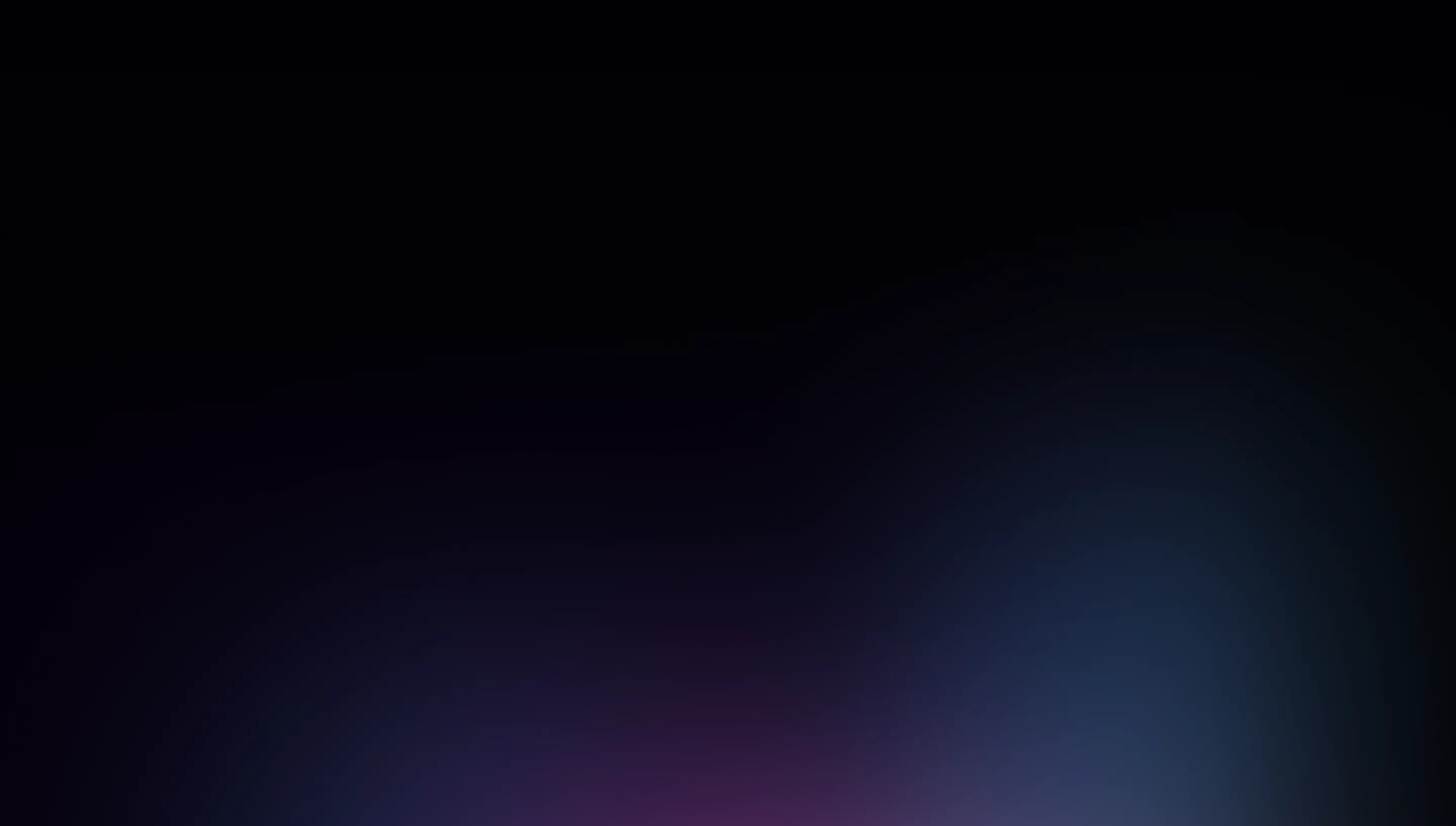 A blurry photo of a cell phone with a black background.