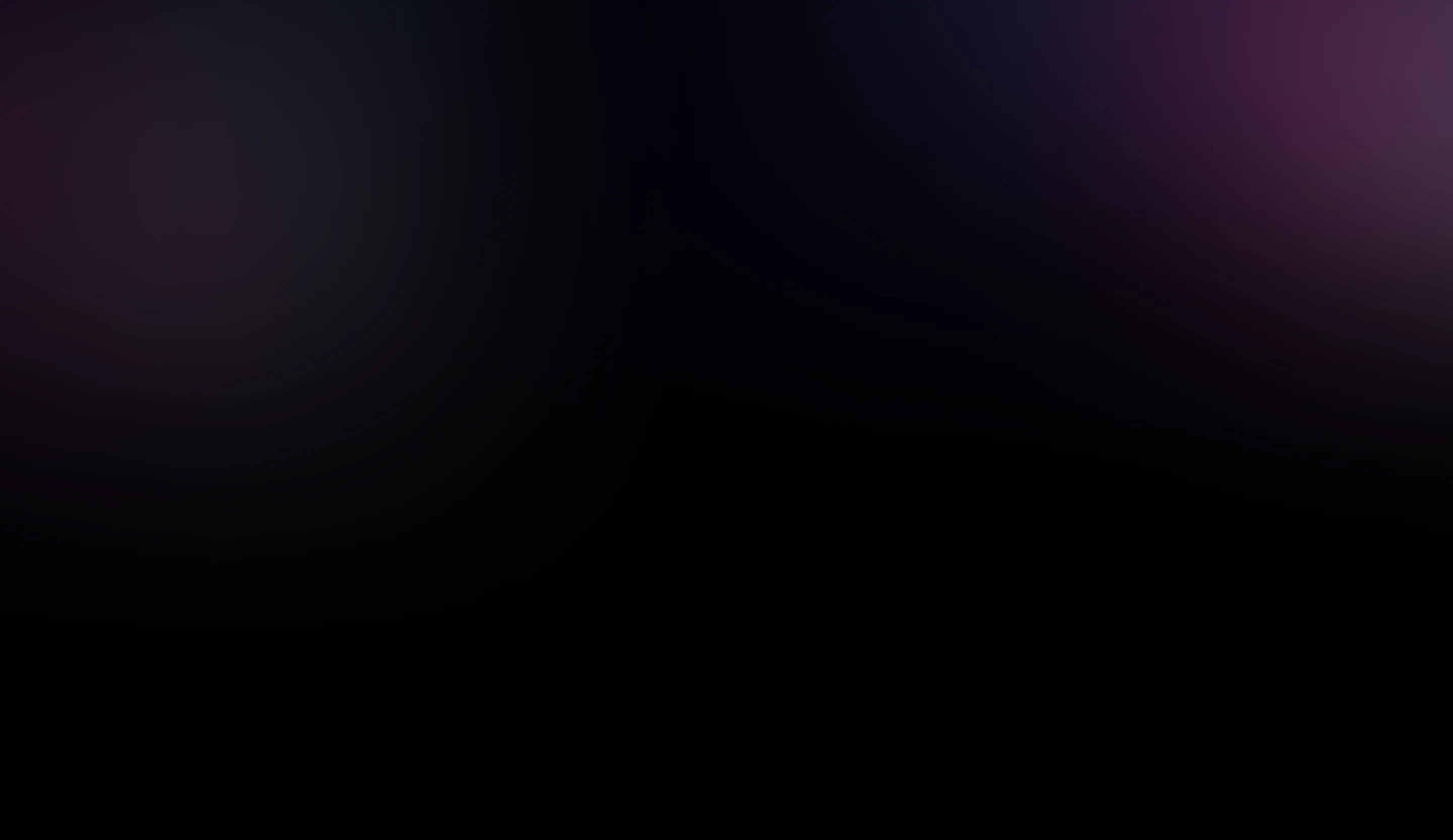 A blurry photo of a cell phone on a black background.