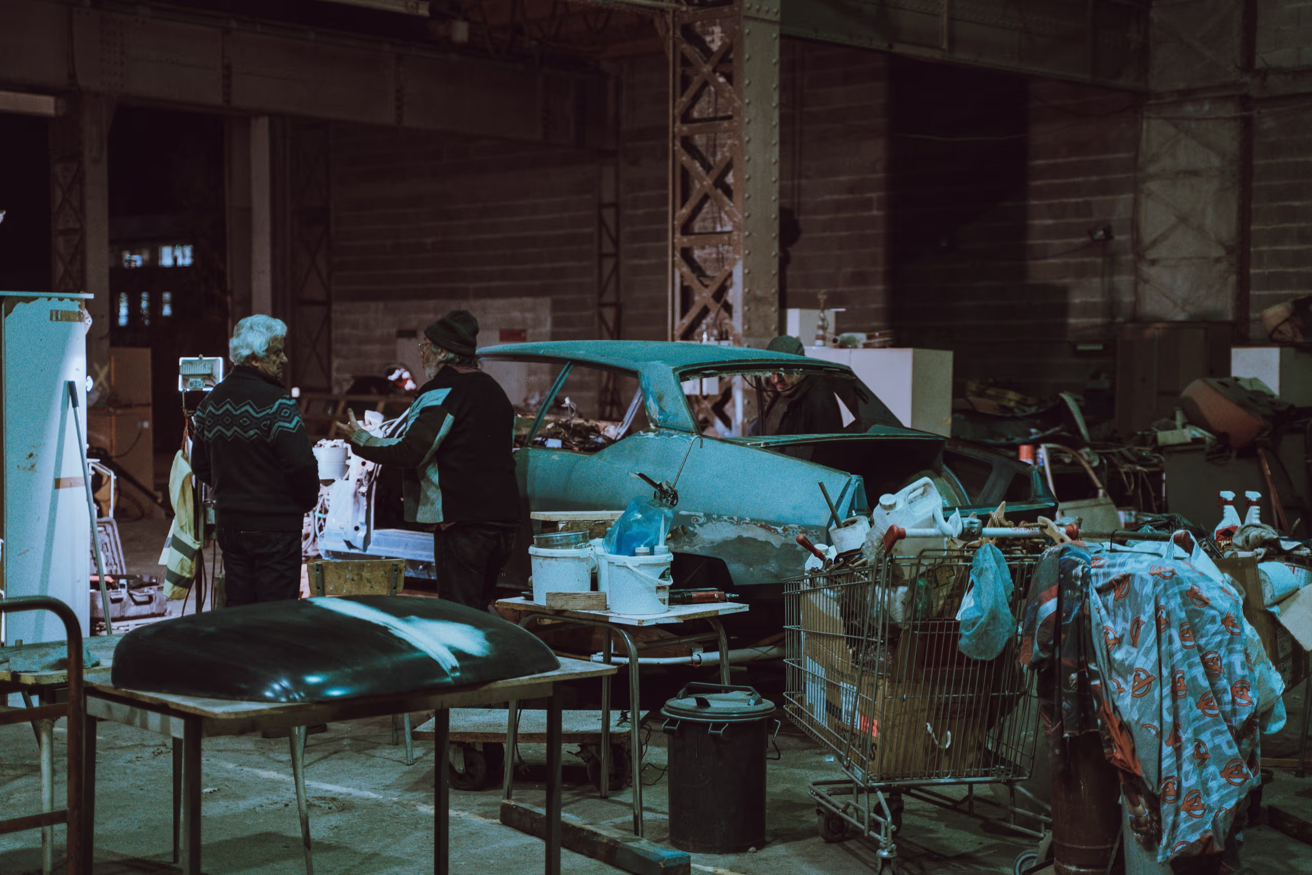 Mechanic inspecting a car at a repair shop