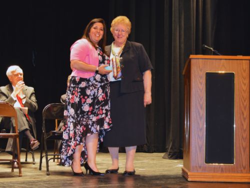 Denise Murray and Sister Kathleen Carberry are standing on the scene together. 