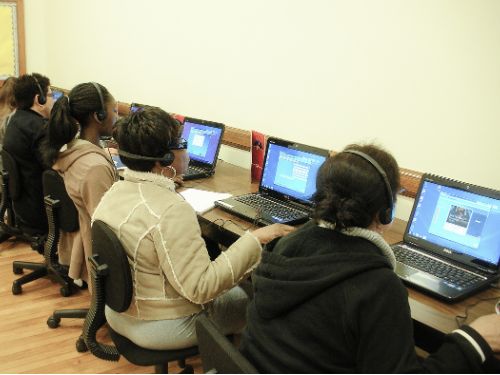 Students are typing on the computers. 