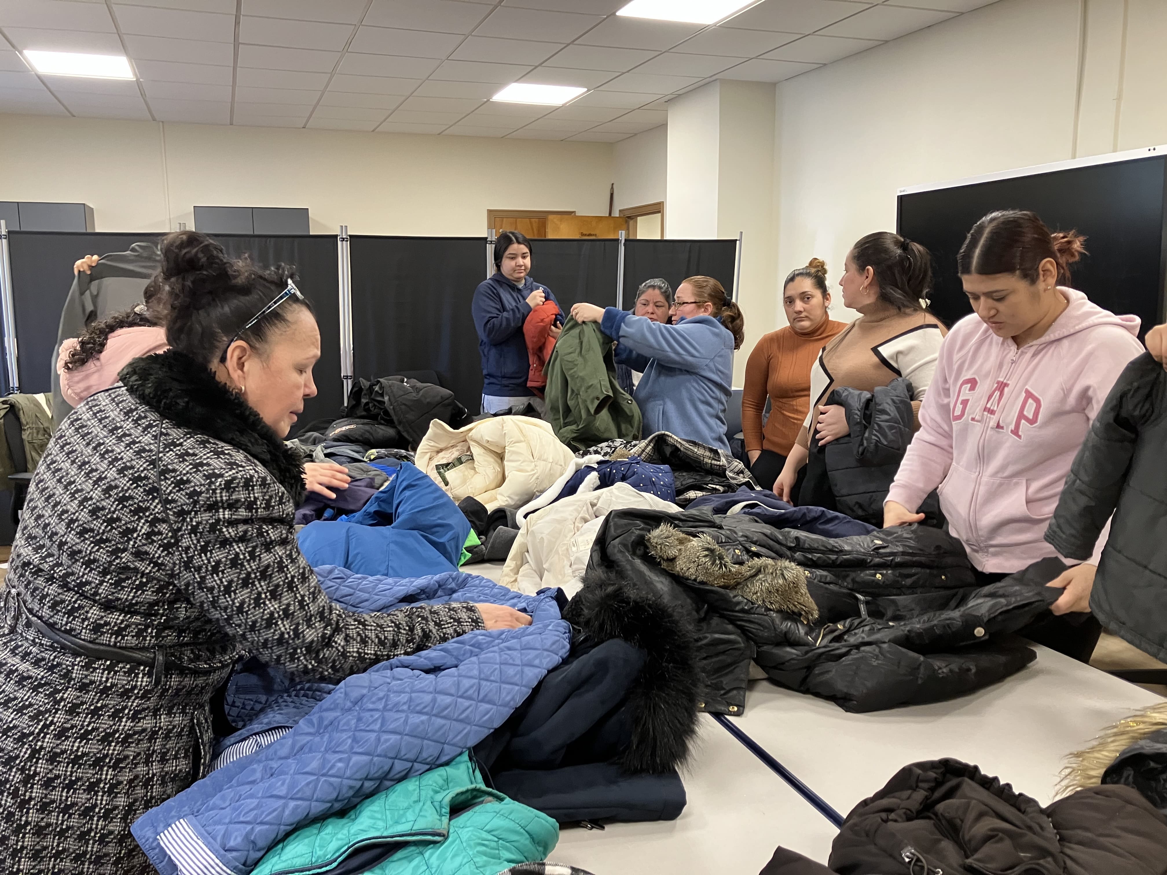 The students are choosing new clothing from the Joseph Closet. 