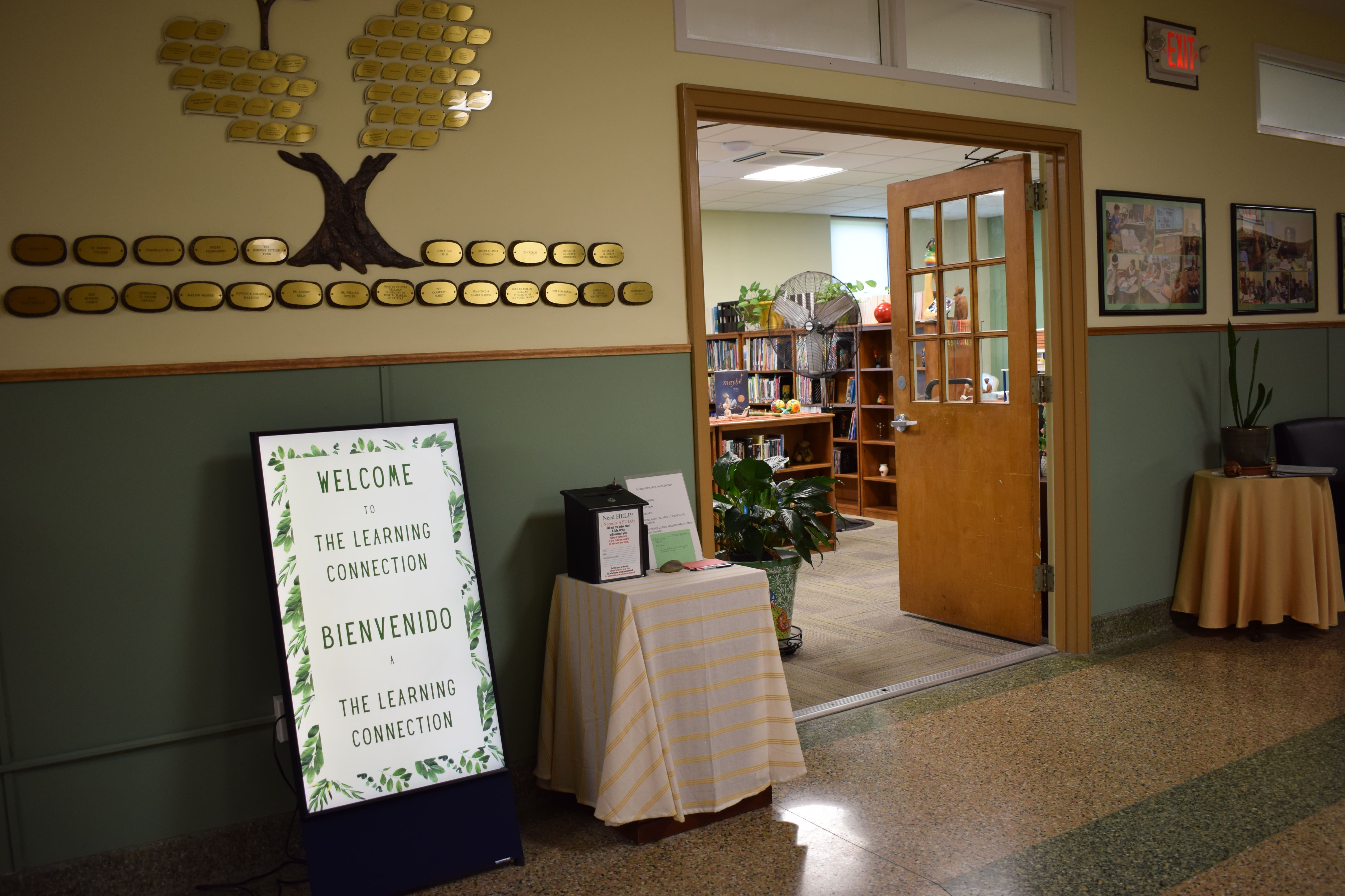 The entrance to the TLC's library, open doors, books visible inside. 
