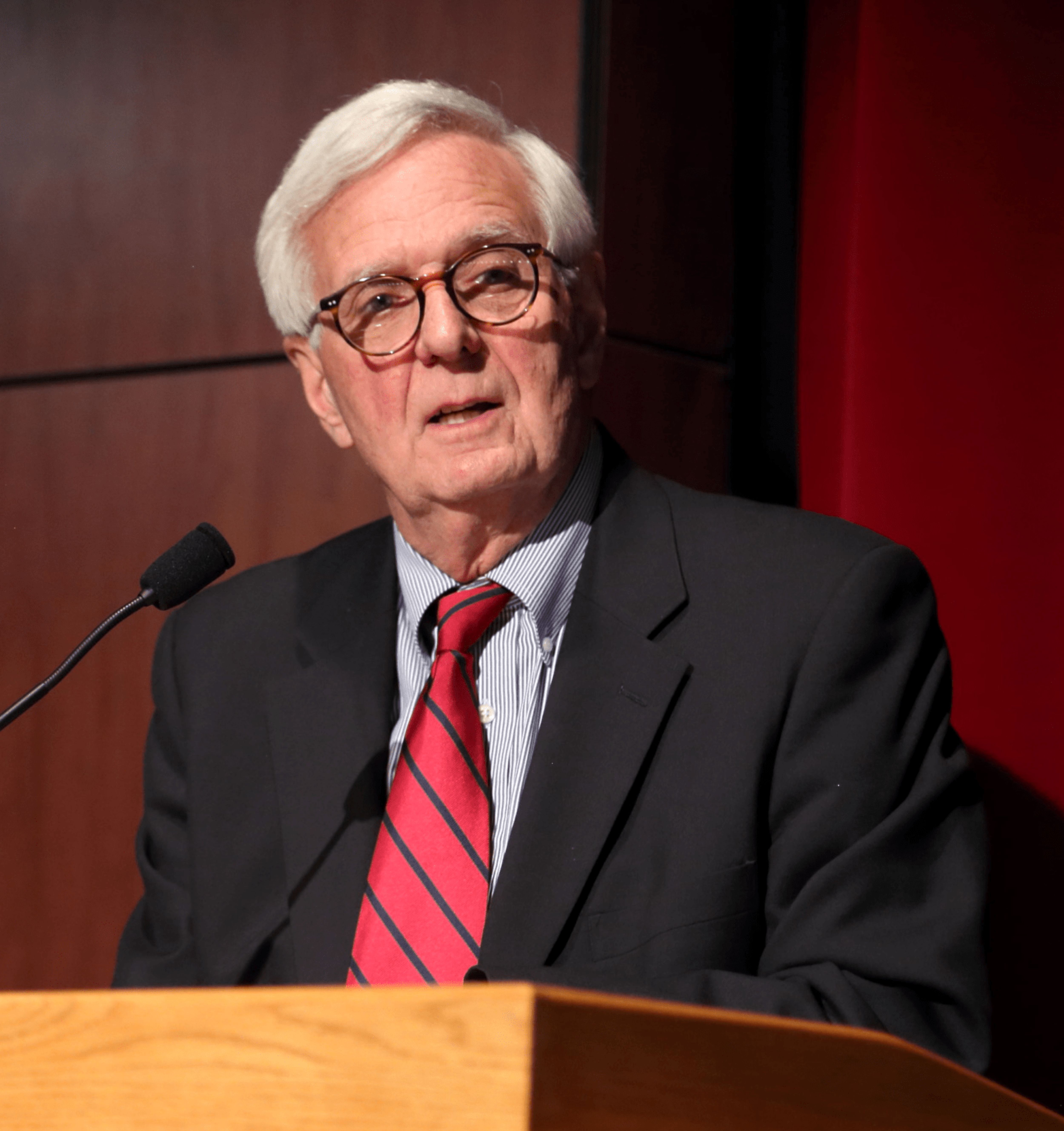 Doctor Thomas Travis speaking to an audience.