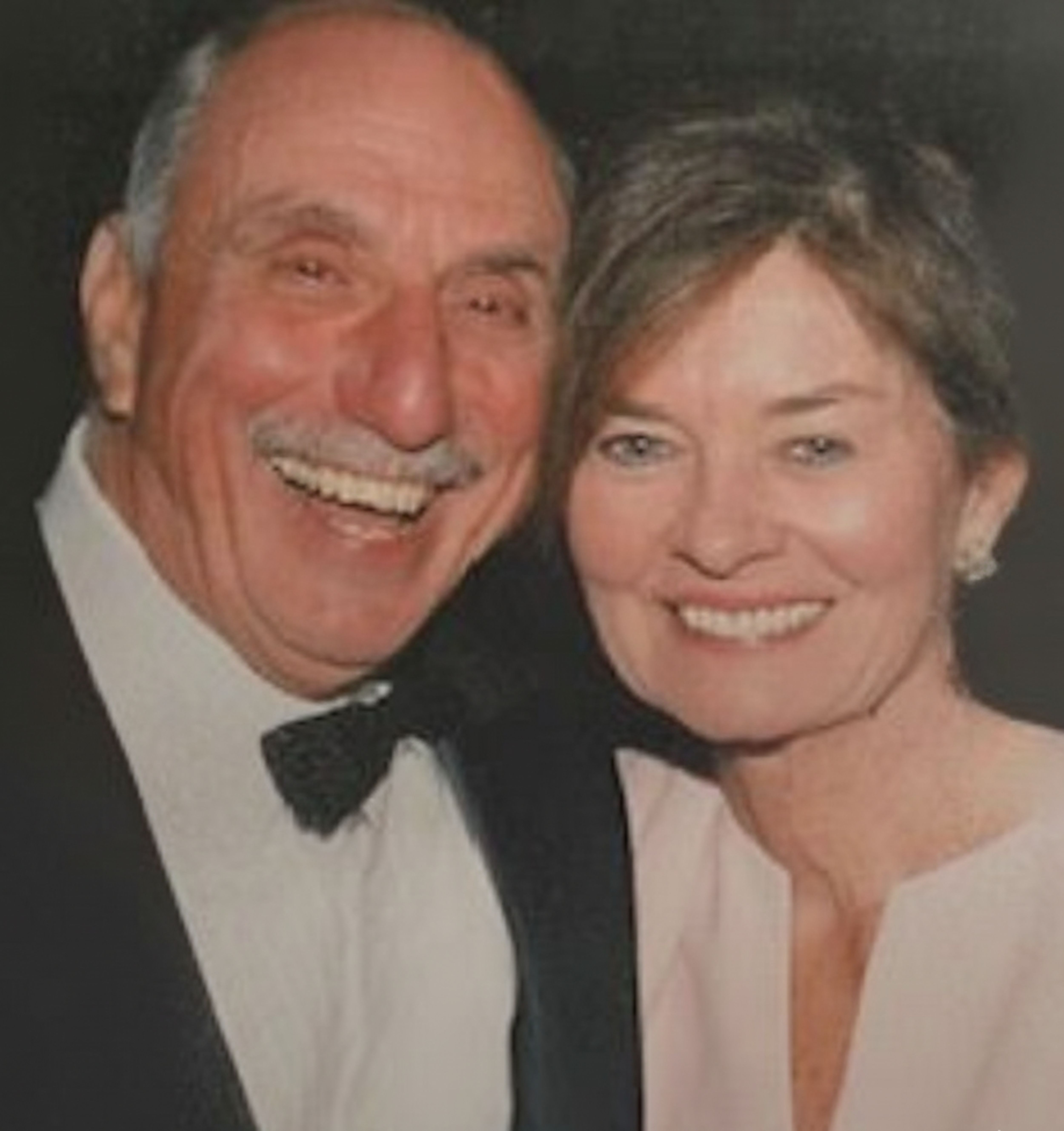 Lamberti couple smiling and looking at the camera, a portrait of a man and woman together.