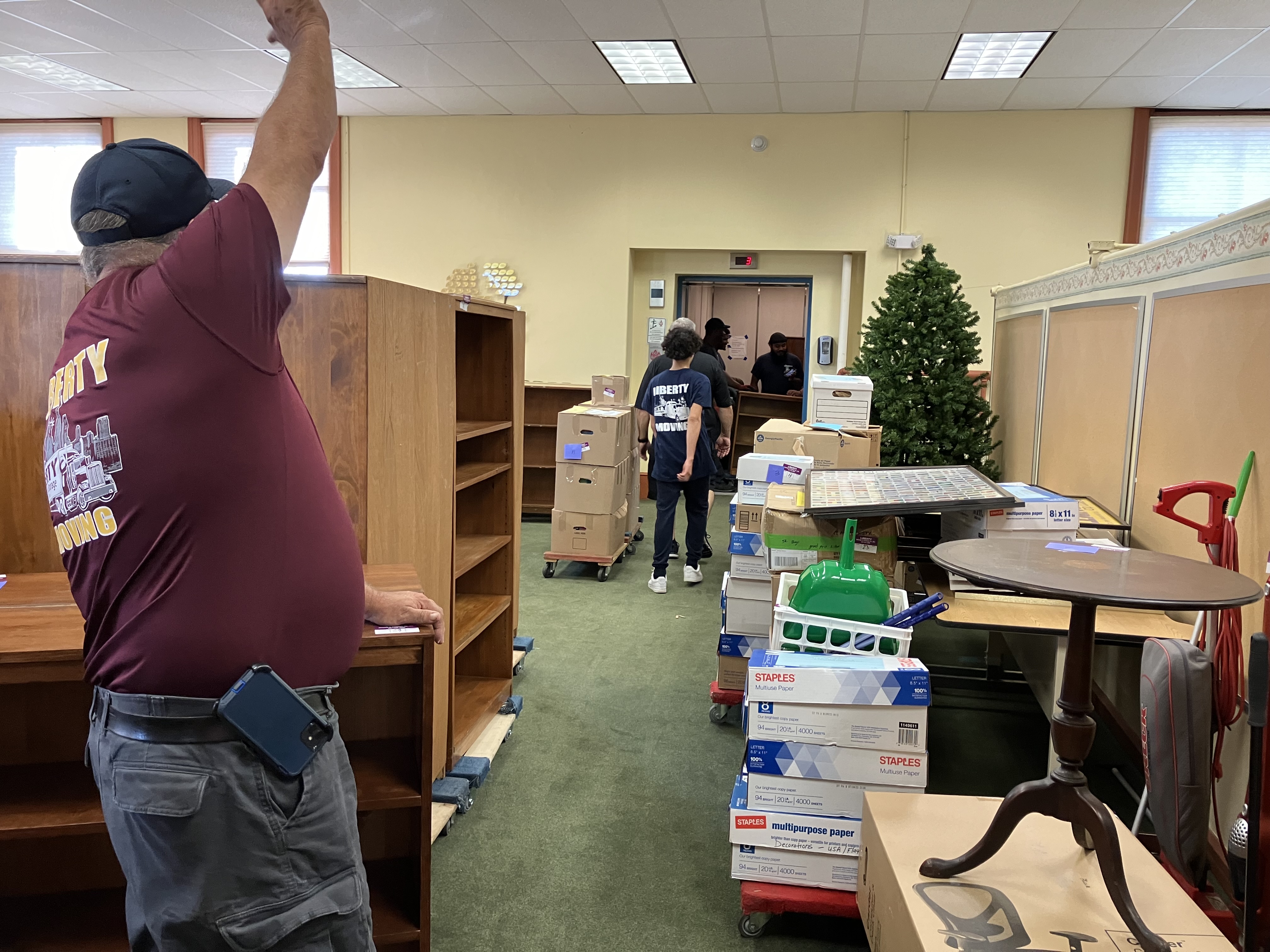 People are moving the staff from the classroom on the moving day. 