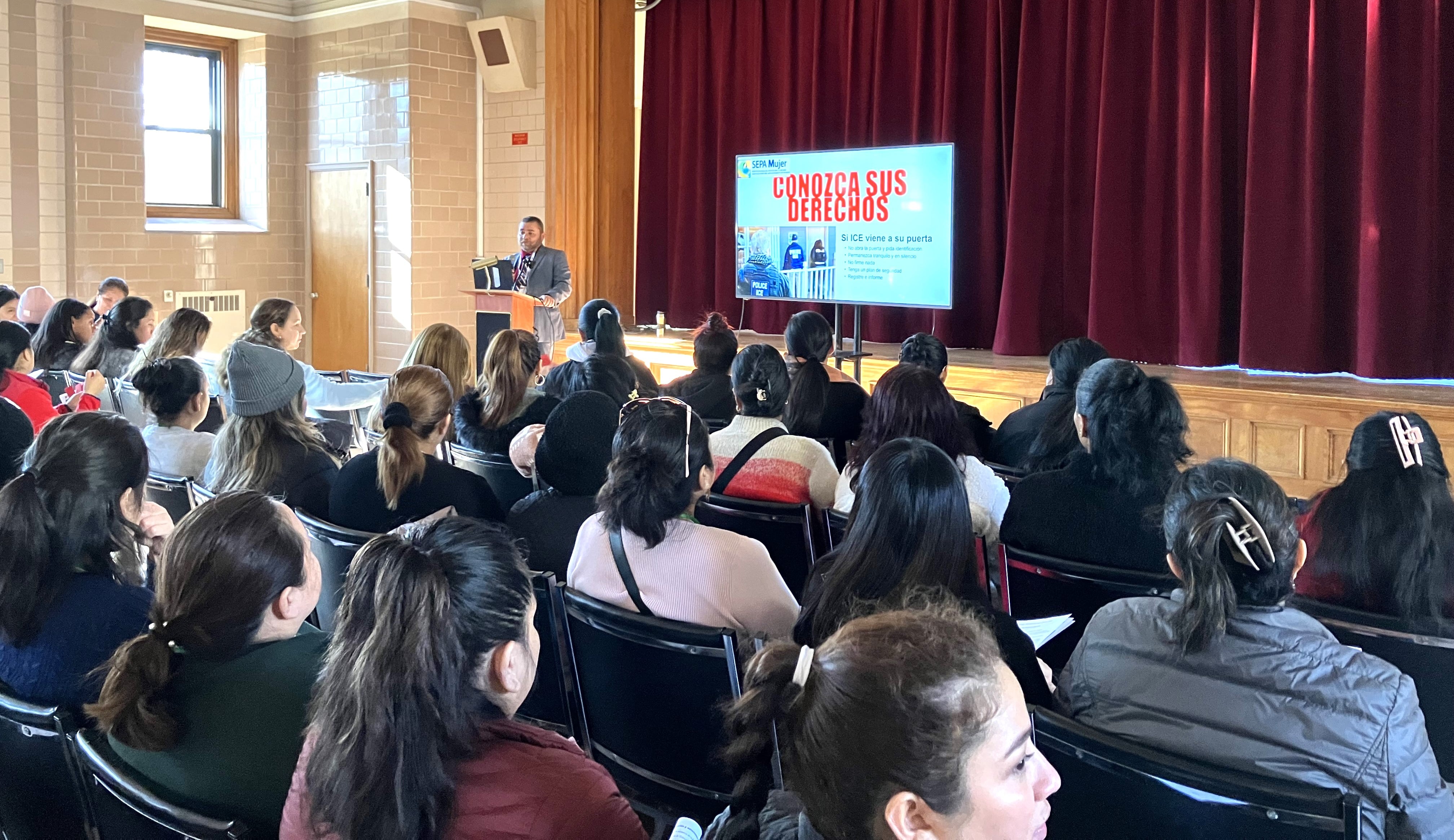 Audience listening during a ‘Make The Road New York’ event supporting immigrant communities.