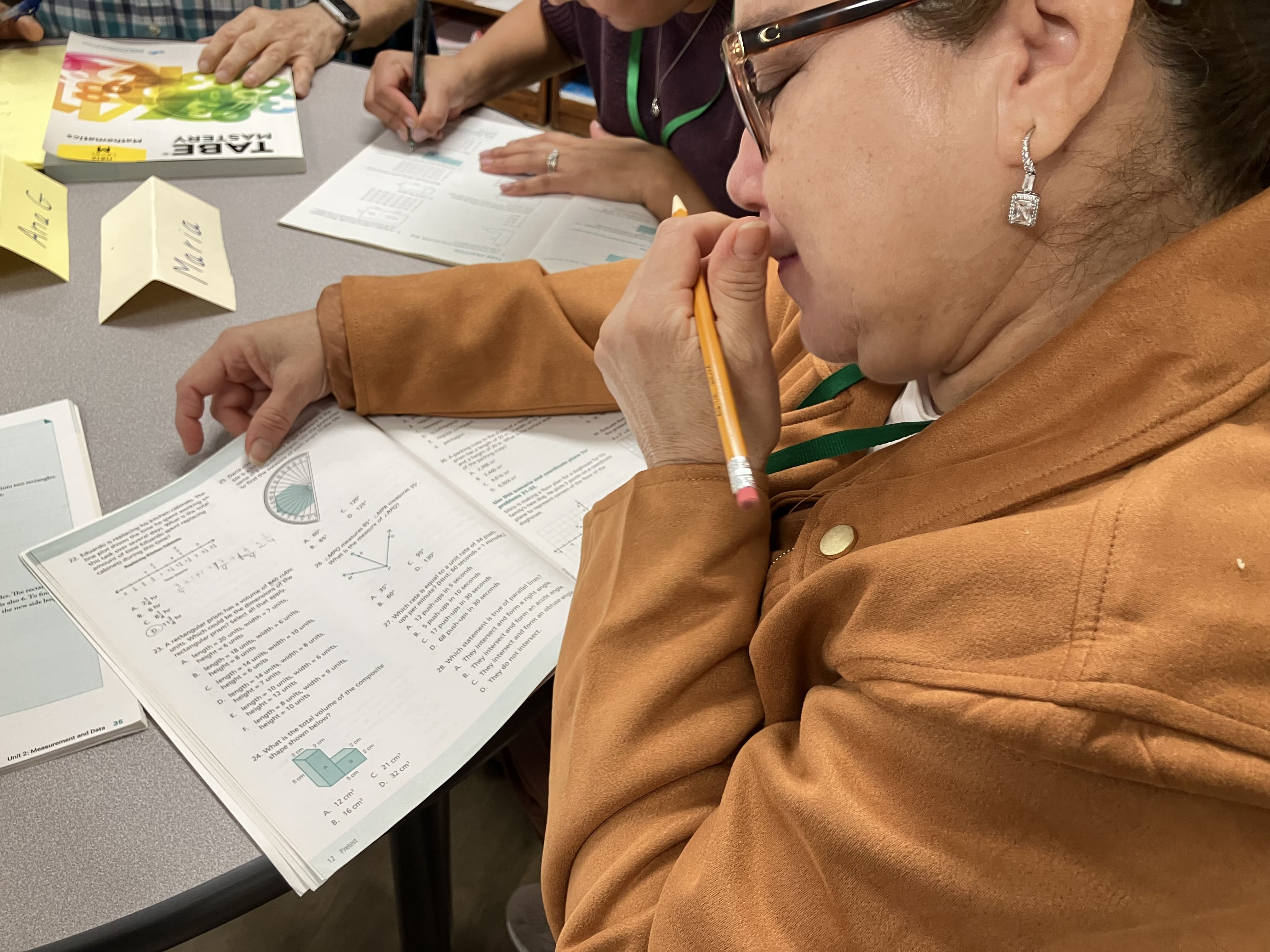 A student is learning from the math book. 