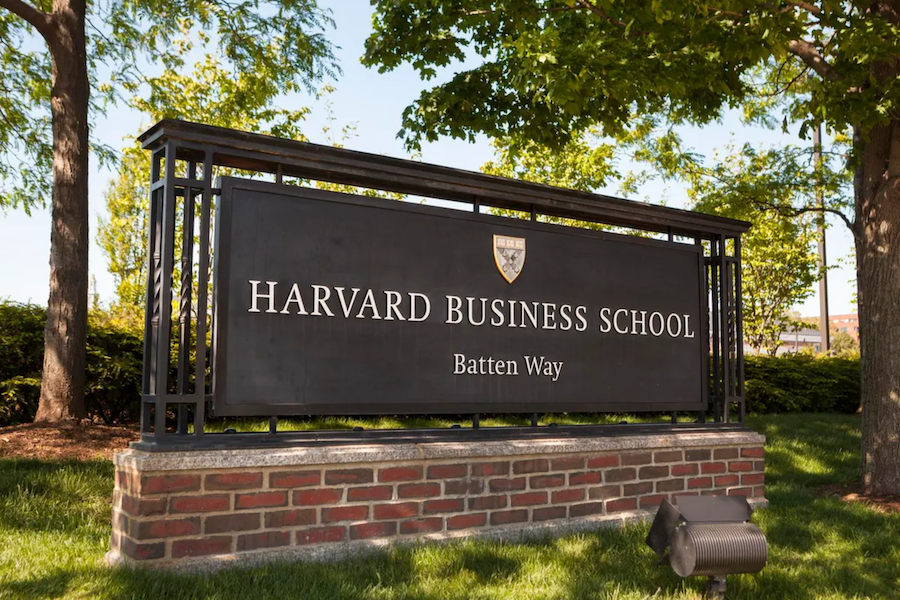 Harvard Business School entrance sign on Batten Way surrounded by trees