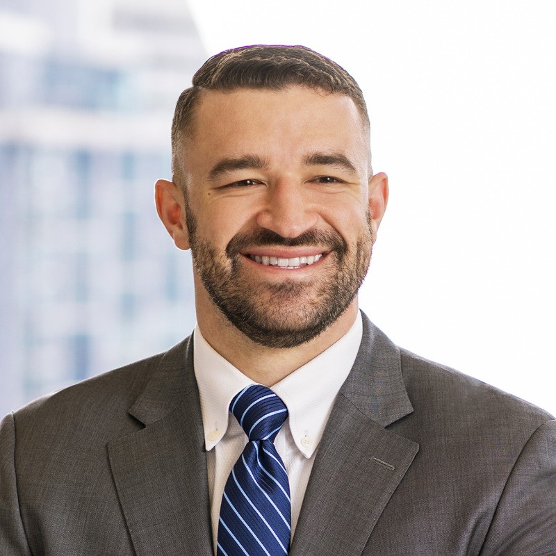 Professional headshot of Luke Groom, successful MBA applicant and M7A client