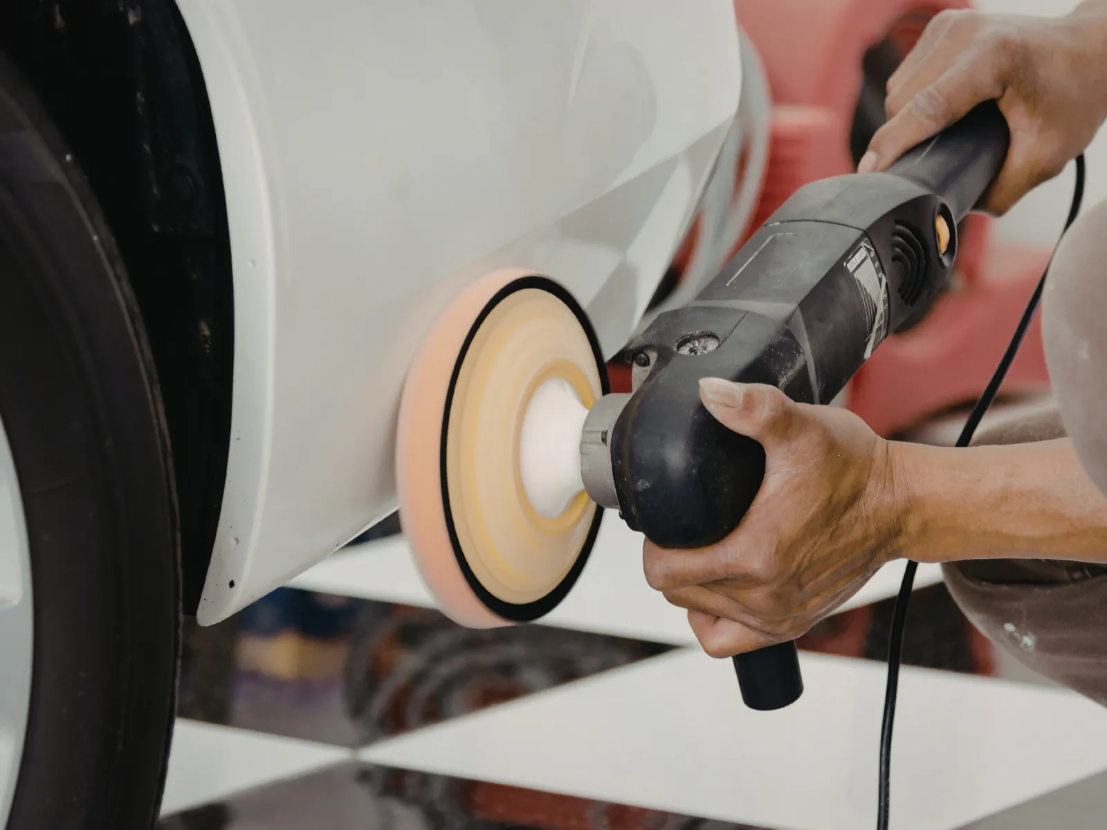 Light scratch removal in Honolulu to improve clear coat appearance by WASHD mobile detailing