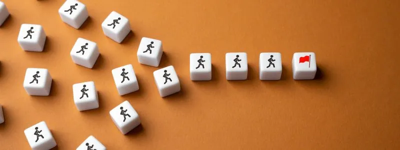 Tiles with people leading to tile with red flag illustrating goal-setting principals for customer marketing.