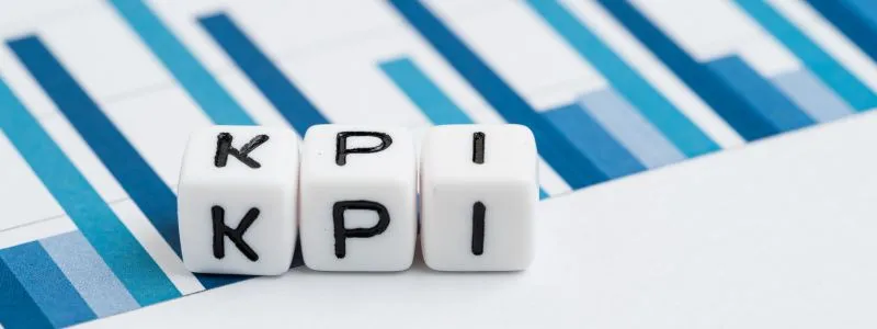 Three blocks with the letters K P and I are face up illustrating the important Sales Reference KPI.