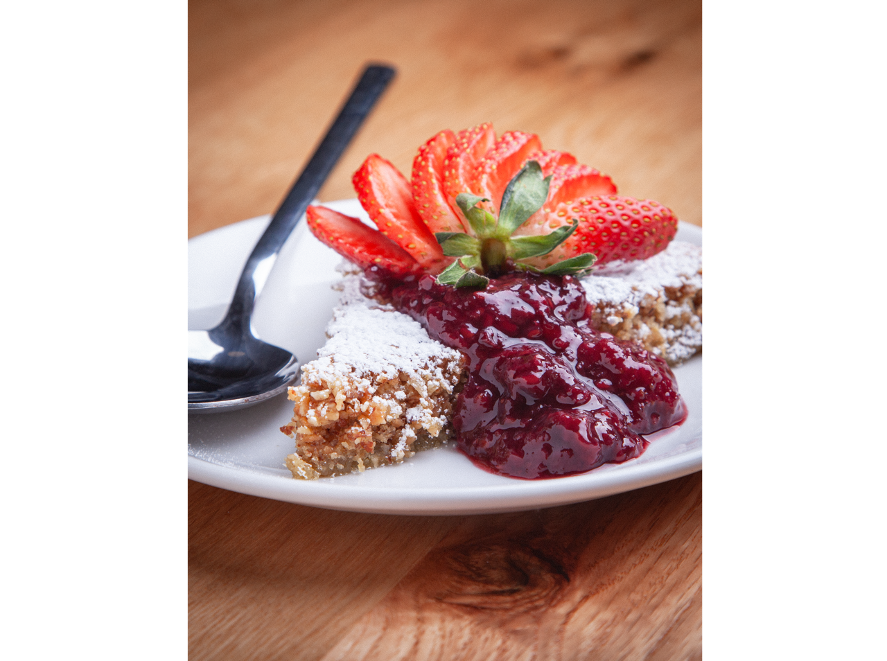 Crispy fried croquettes served on a white plate with roasted garlic aioli dipping sauce at DeWolf Brewing, Victor NY