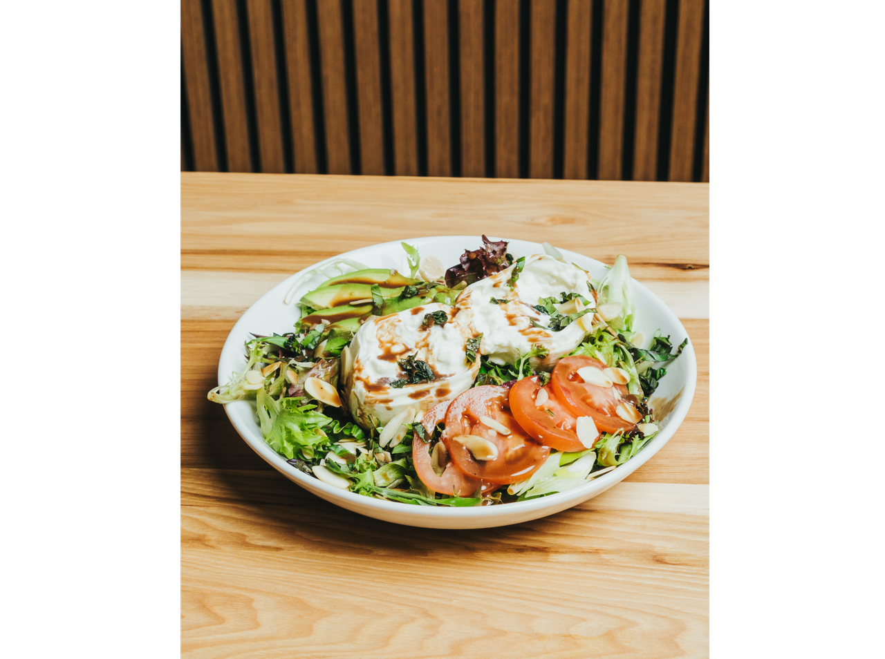 Crispy fried croquettes served on a white plate with roasted garlic aioli dipping sauce at DeWolf Brewing, Victor NY