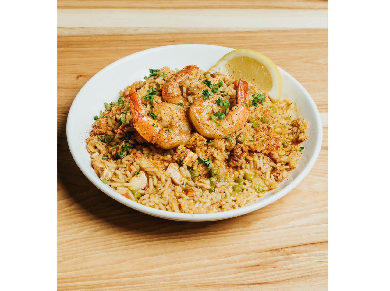 Crispy fried croquettes served on a white plate with roasted garlic aioli dipping sauce at DeWolf Brewing, Victor NY