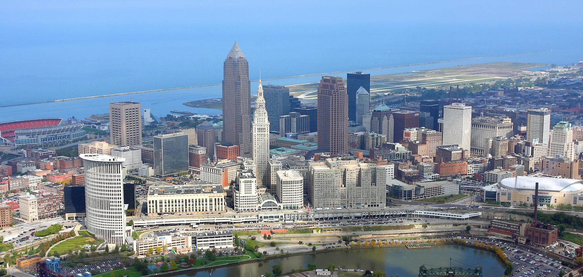 Aerial view of Cleveland, Ohio downtown skyline with Lake Erie in the background and prominent skyscrapers including Key Tower and Terminal Tower.