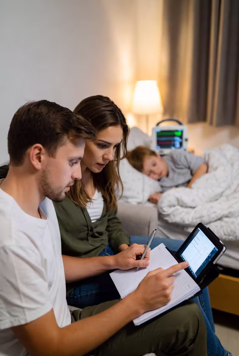 Family using a tablet to review child support information at home.
