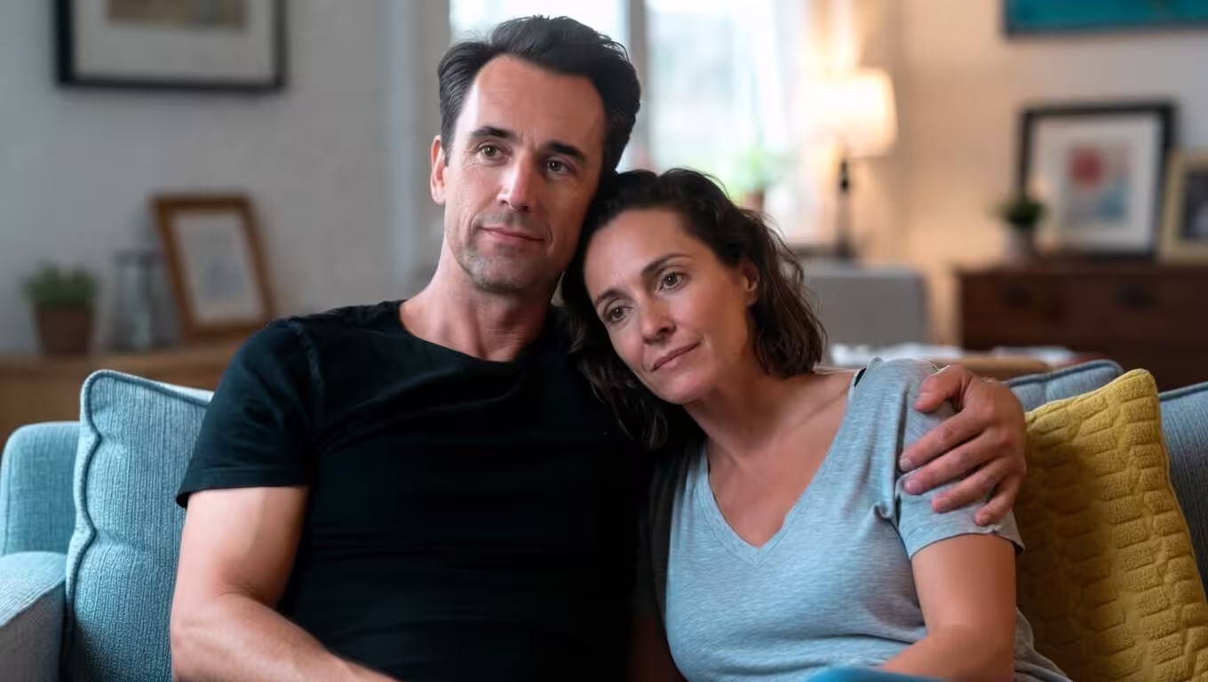 Parents sitting together at home while navigating special needs family challenges.