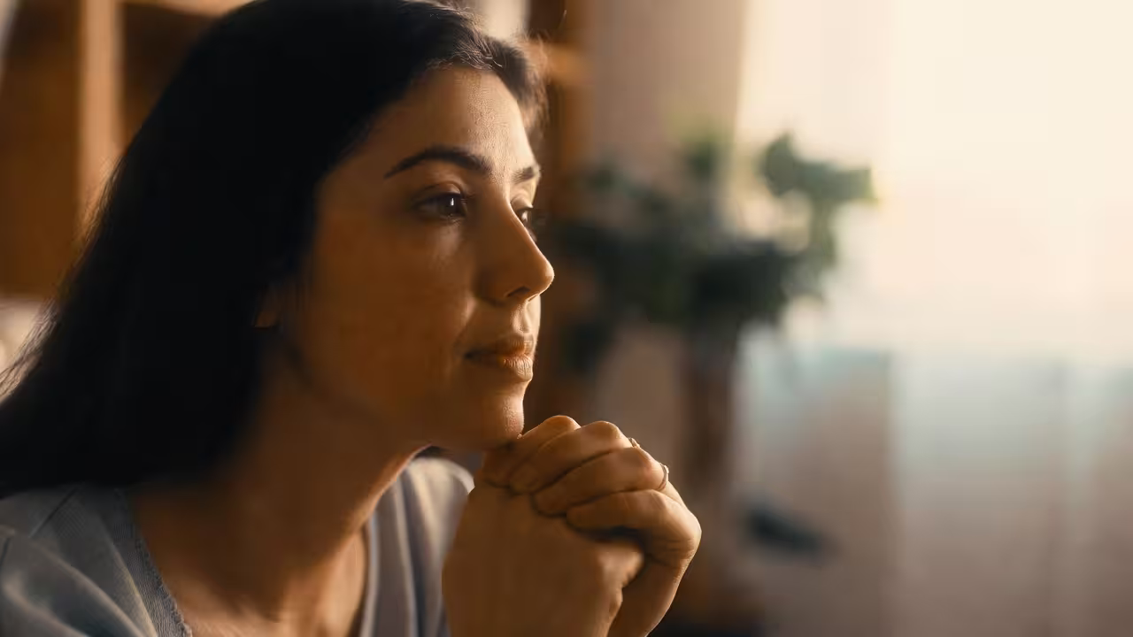 Caregiver listening thoughtfully during a special needs support conversation.