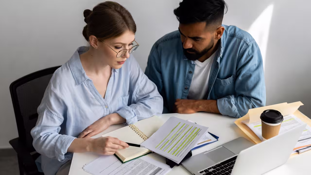 Parents prepare for school meeting: studying IEP vs 504 Plan, documents, notes
