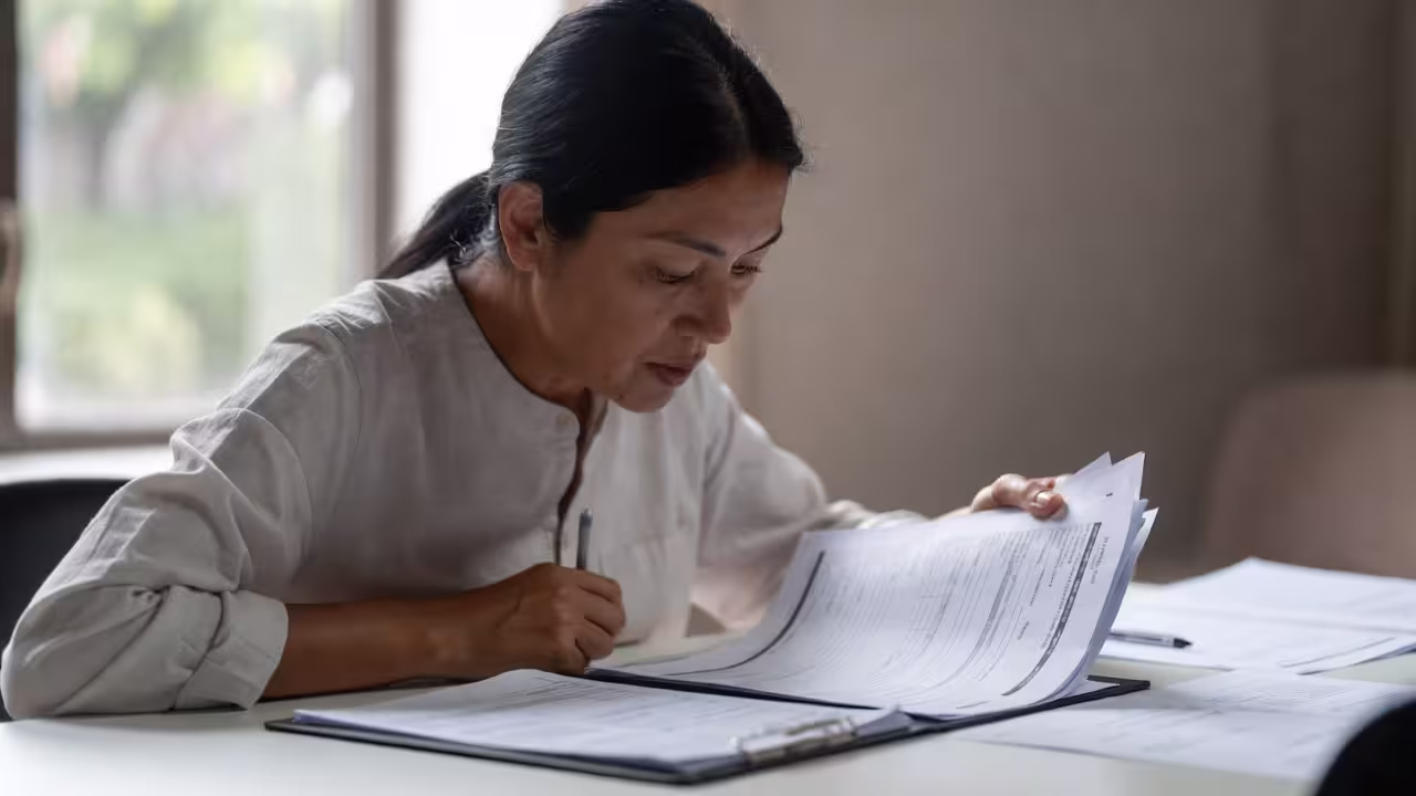 Mother reviewing IEP goals during a school meeting