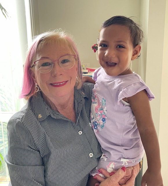 Woman smiling with child