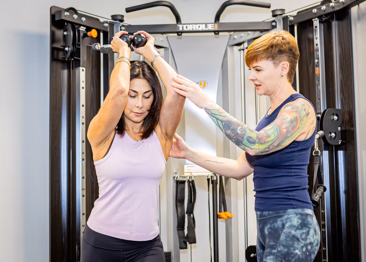 Kate Bolia coaching client with advanced strength training — precision movement strategies for resilience and vitality at Apex.