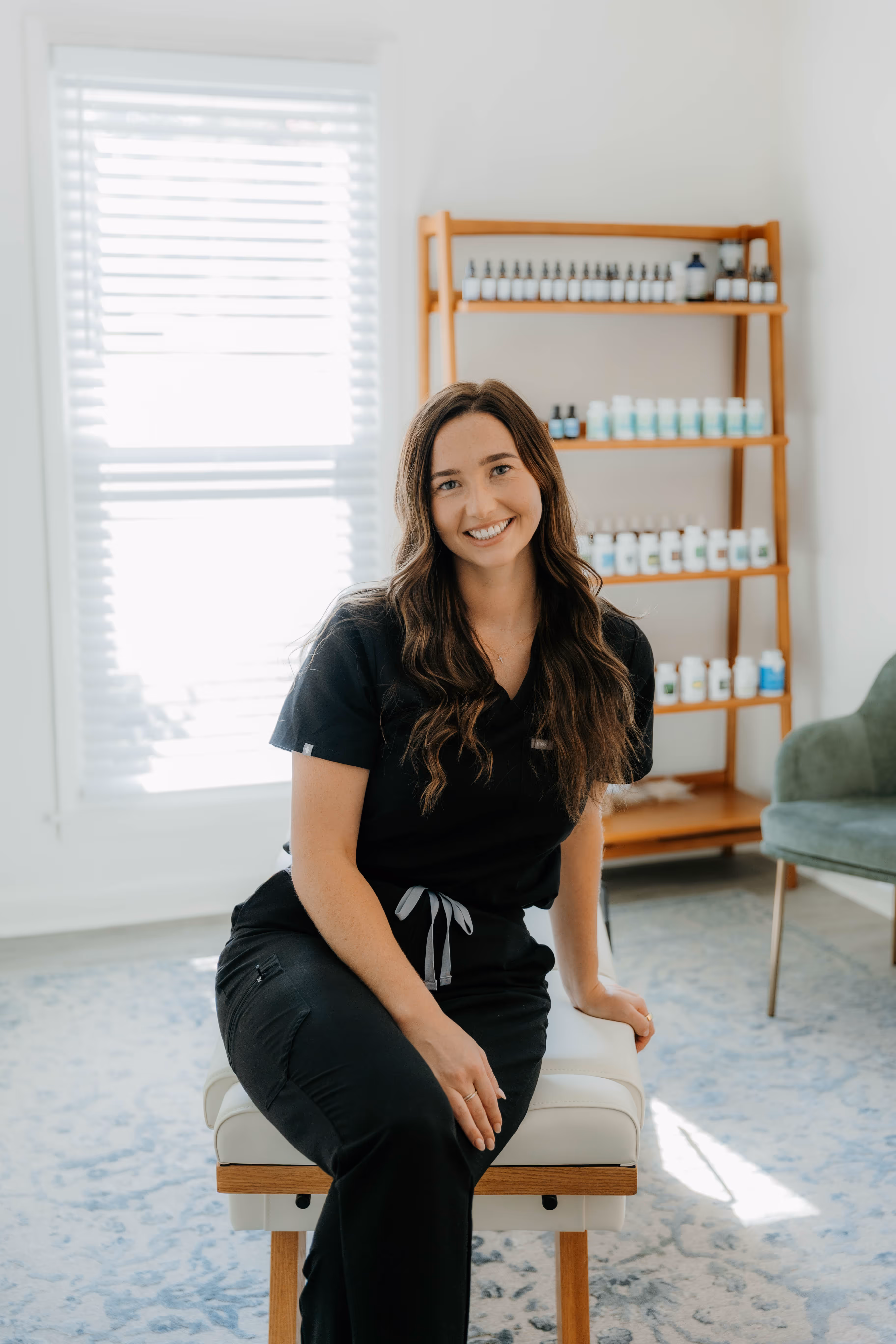 Dr. Bethany Provencial smiling in portrait, Apex chiropractic and QNRT care specialist.