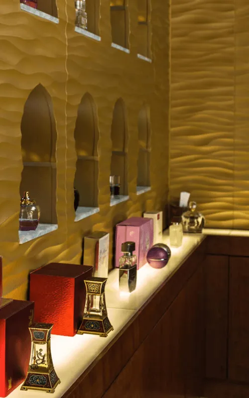 a stand with many perfumes of different types and names