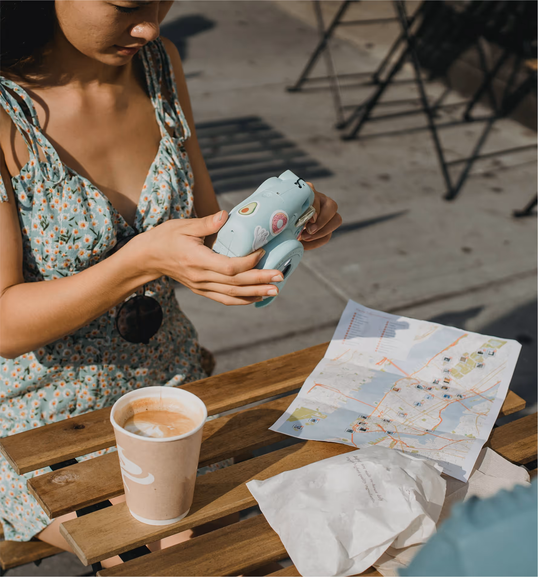 Traveller planning a trip with a map and phone
