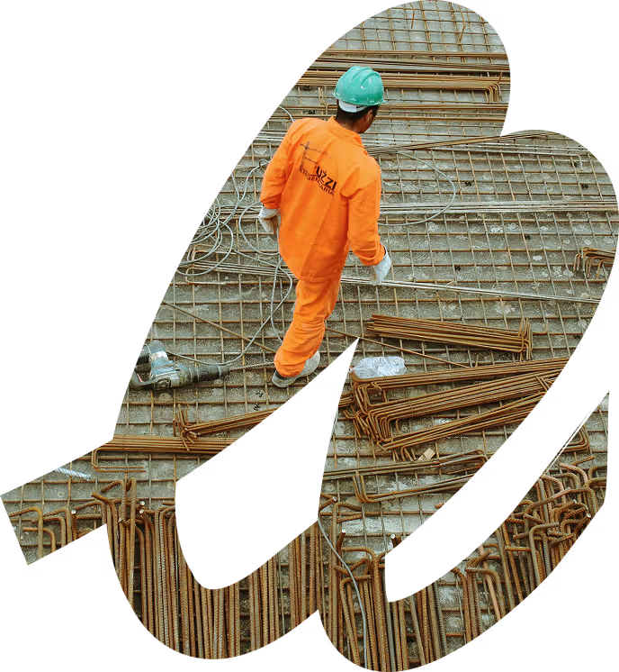 Construction worker on job site walking on rebar