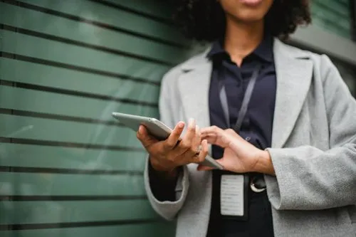 woman holding tablet